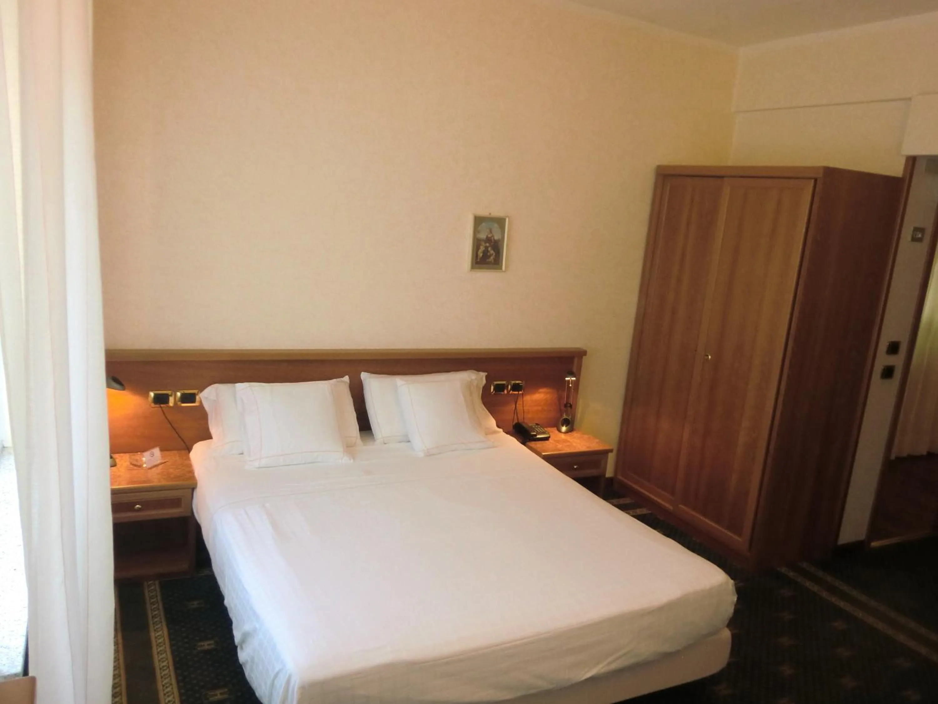 Bed in Hotel Ariston