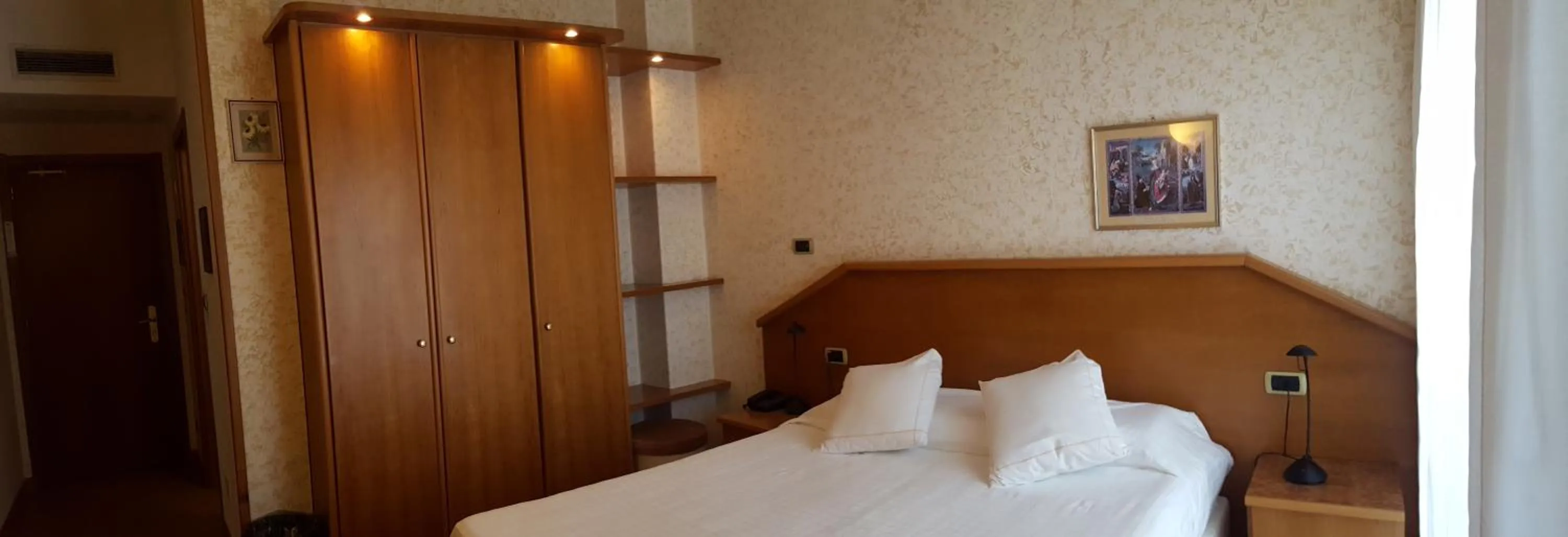 Bed in Hotel Ariston