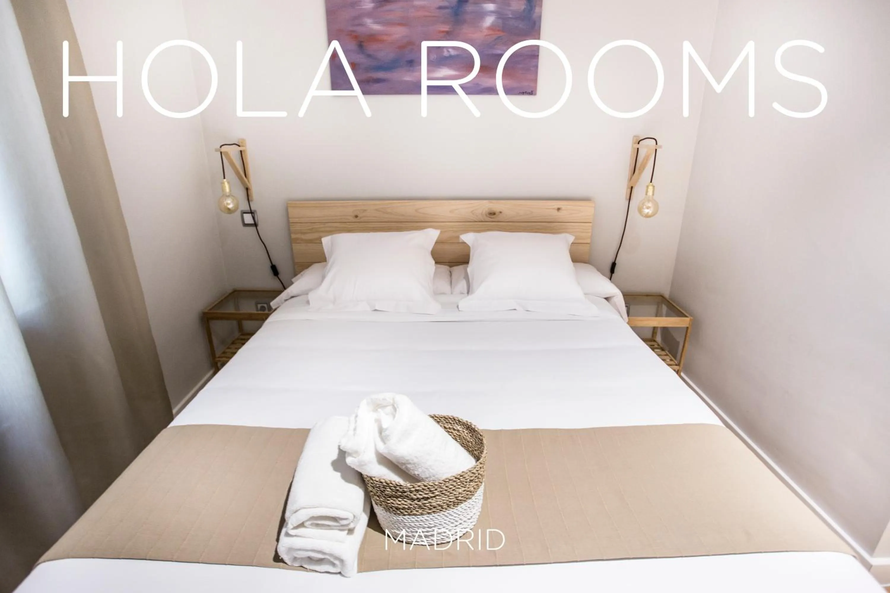 Bed in Hola Rooms