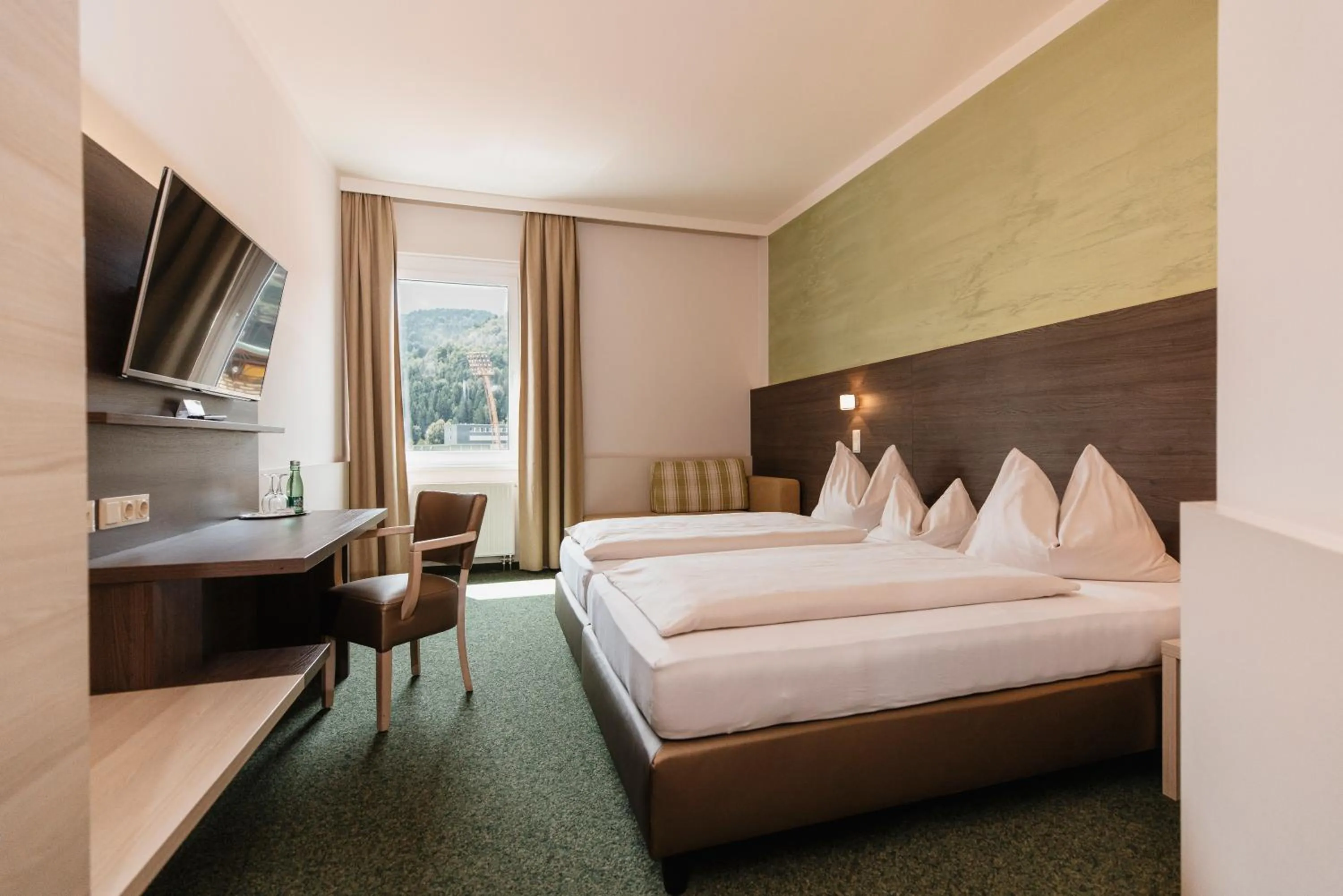 Photo of the whole room, Bed in Sporthotel Kapfenberg