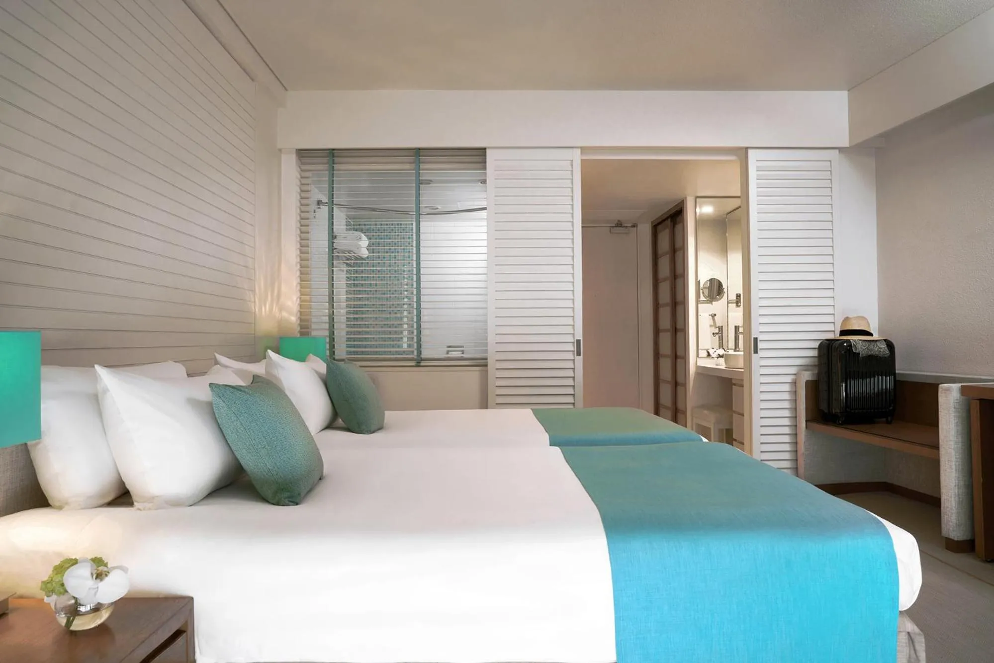 Bed in ANA InterContinental Manza Beach Resort by IHG