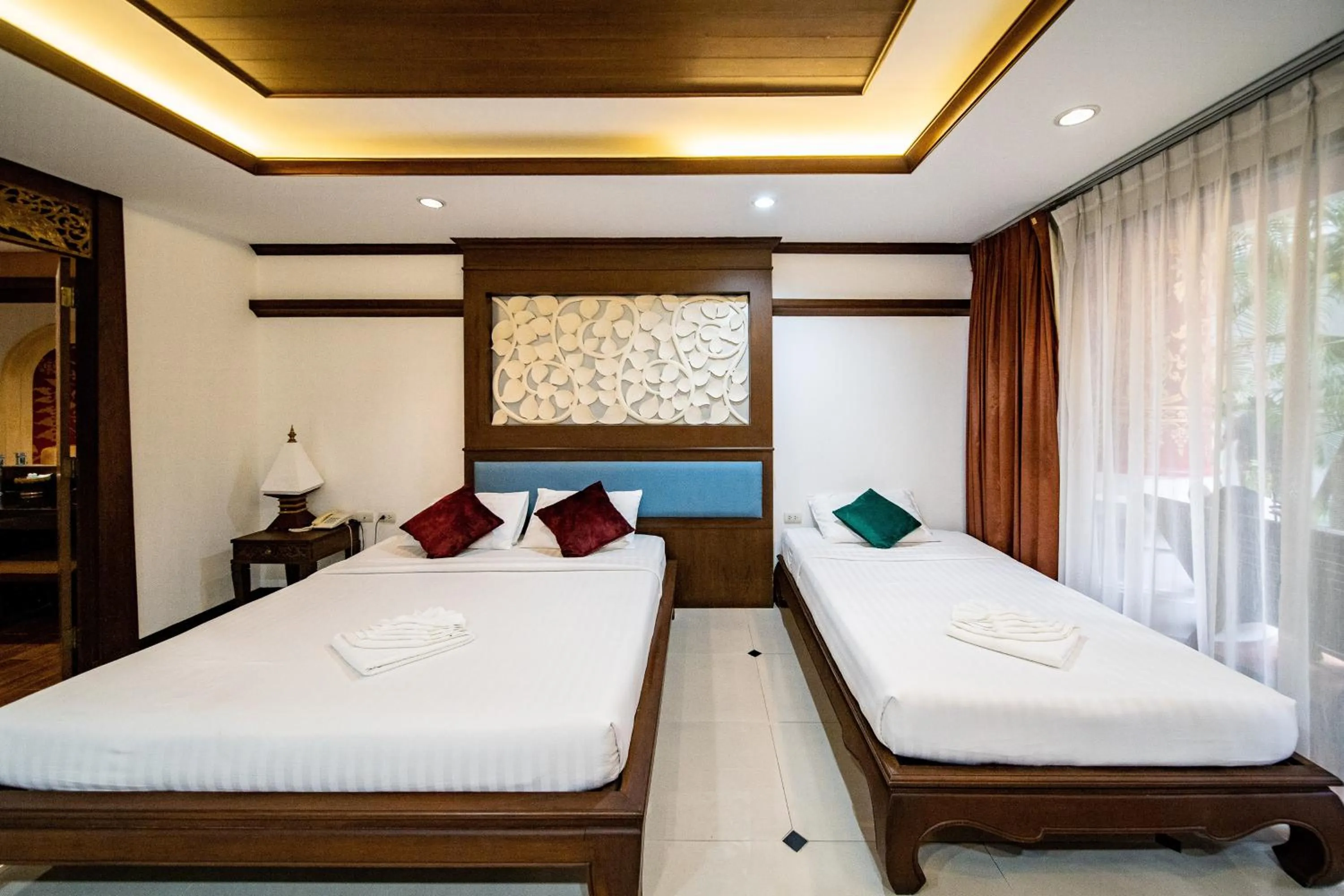 Bed in Kasalong Resort and Spa Pattaya