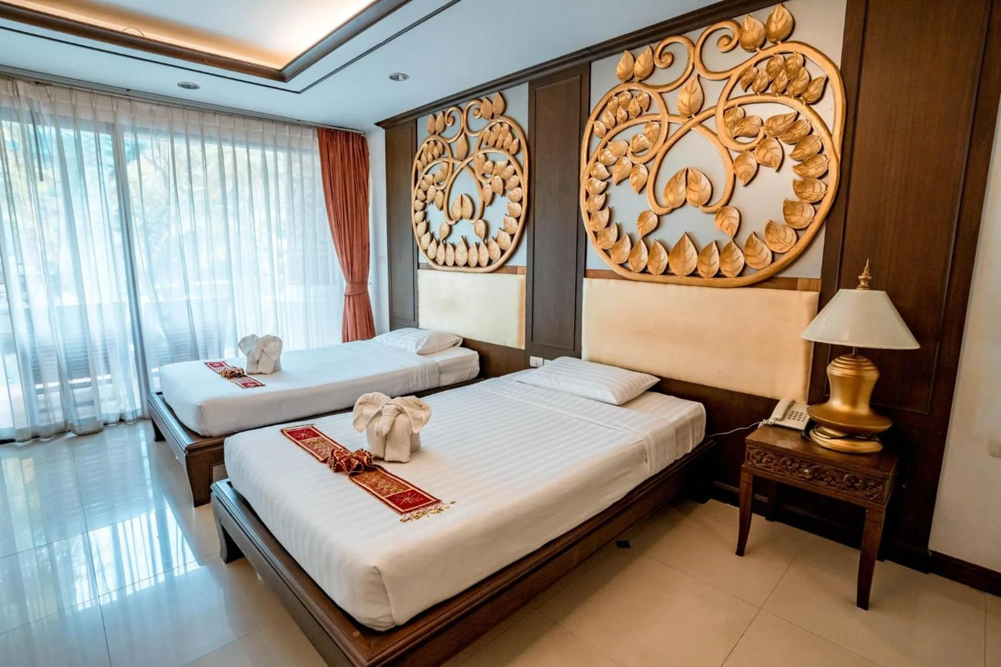 Bed in Kasalong Resort and Spa Pattaya