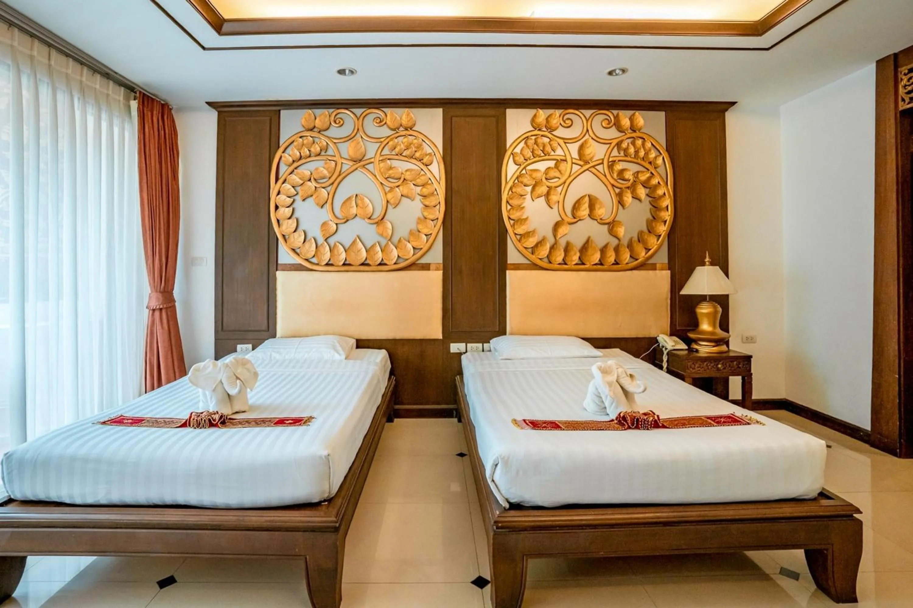 Bed in Kasalong Resort and Spa Pattaya