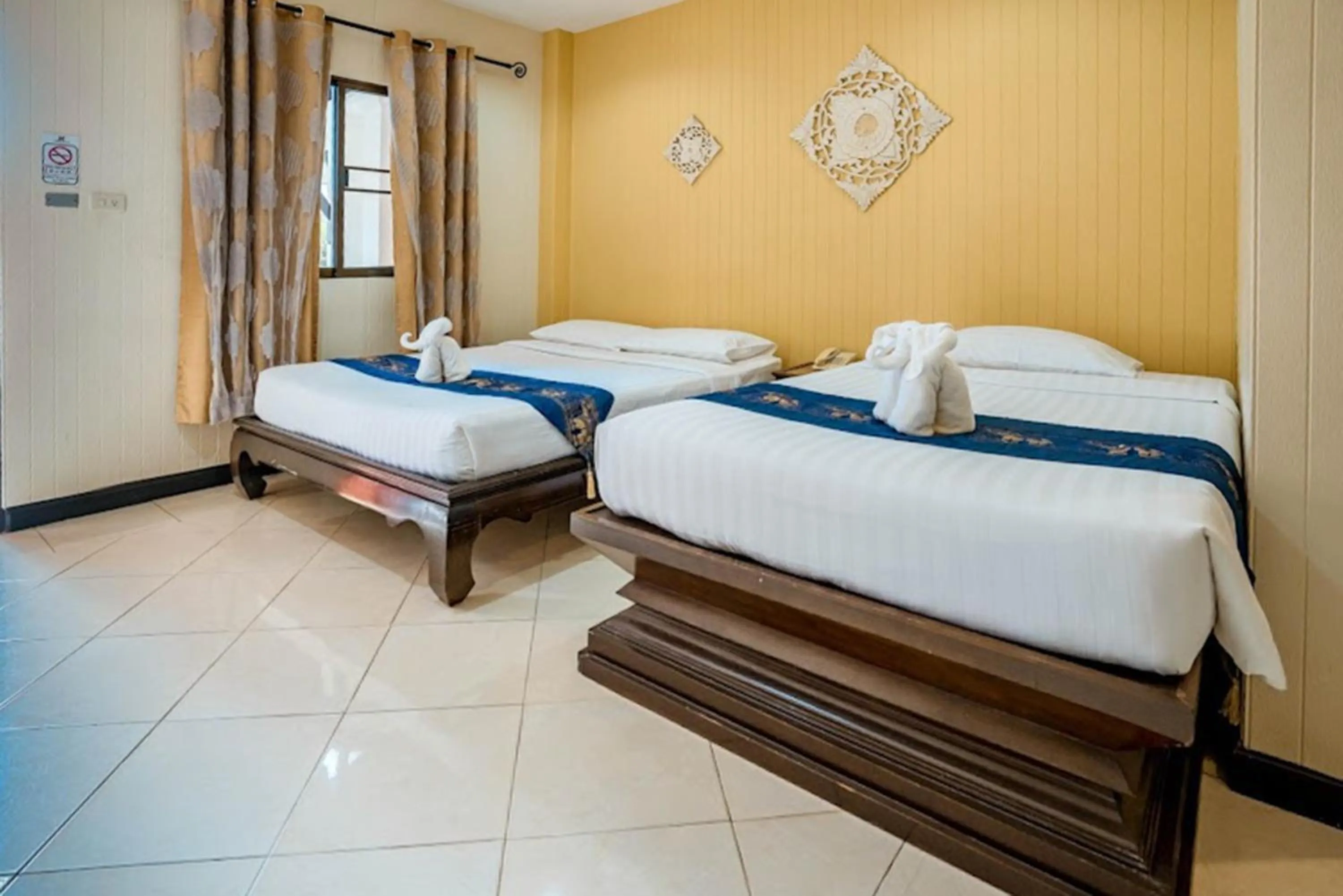 Bed in Kasalong Resort and Spa Pattaya