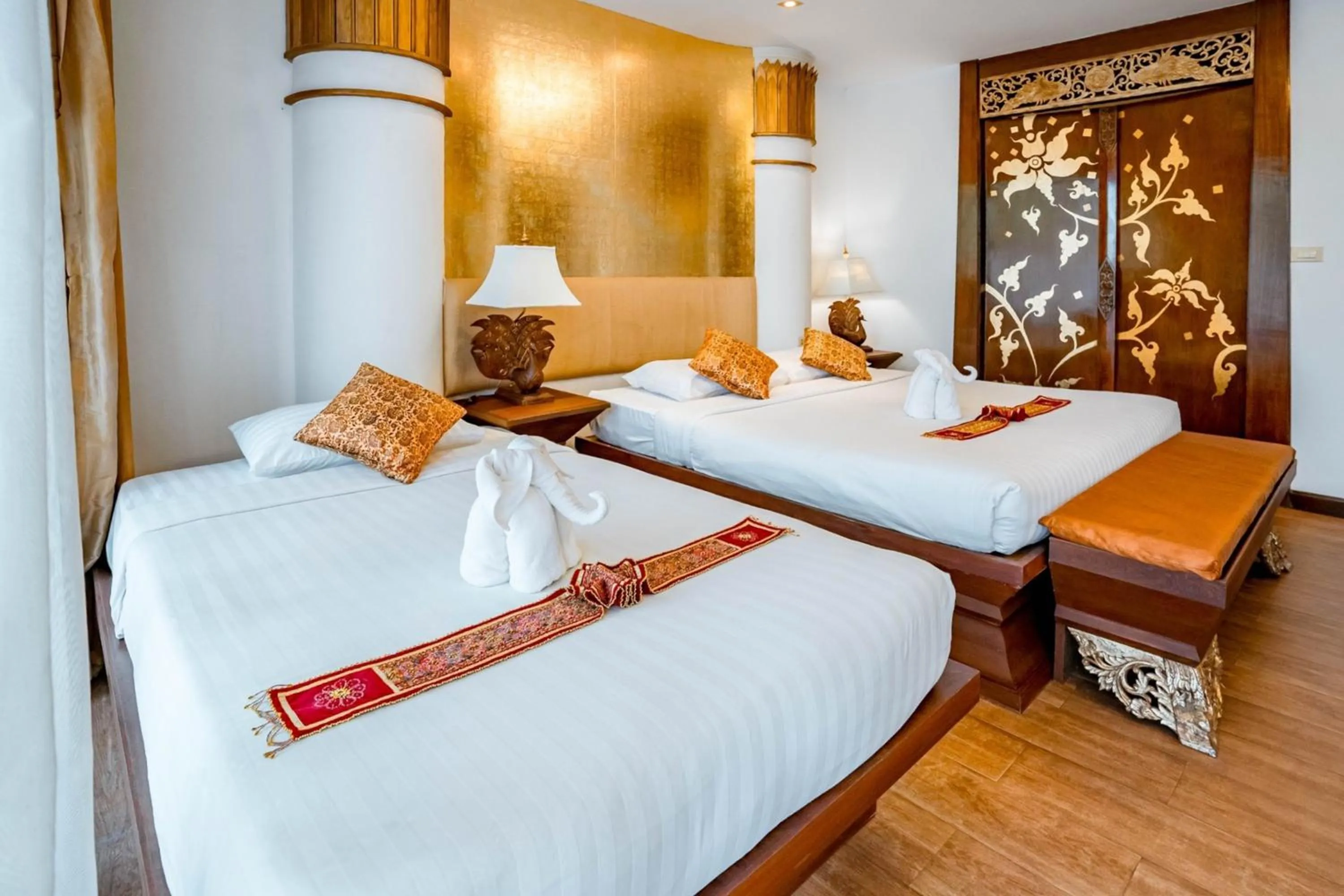 Bed in Kasalong Resort and Spa Pattaya