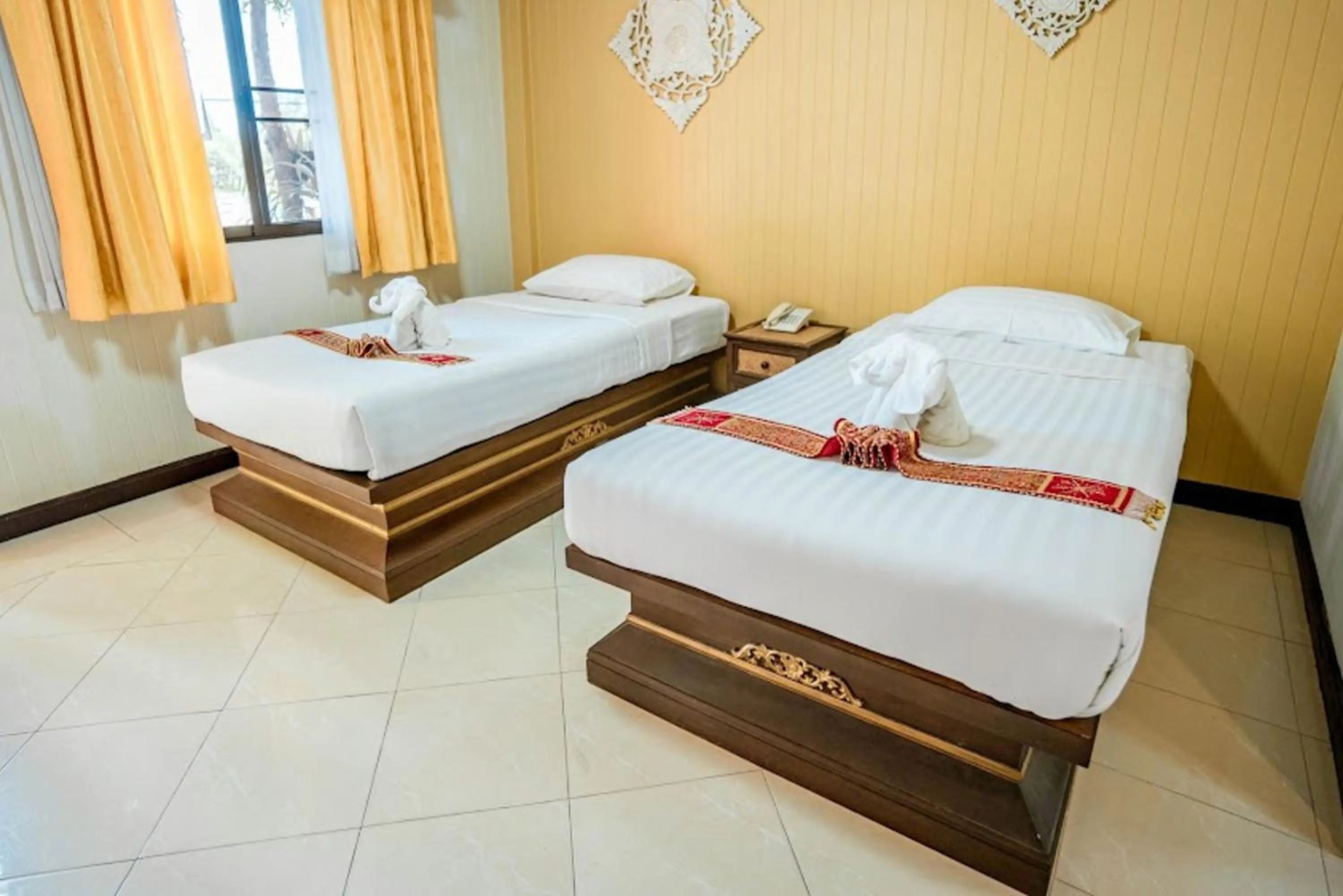 Bed in Kasalong Resort and Spa Pattaya