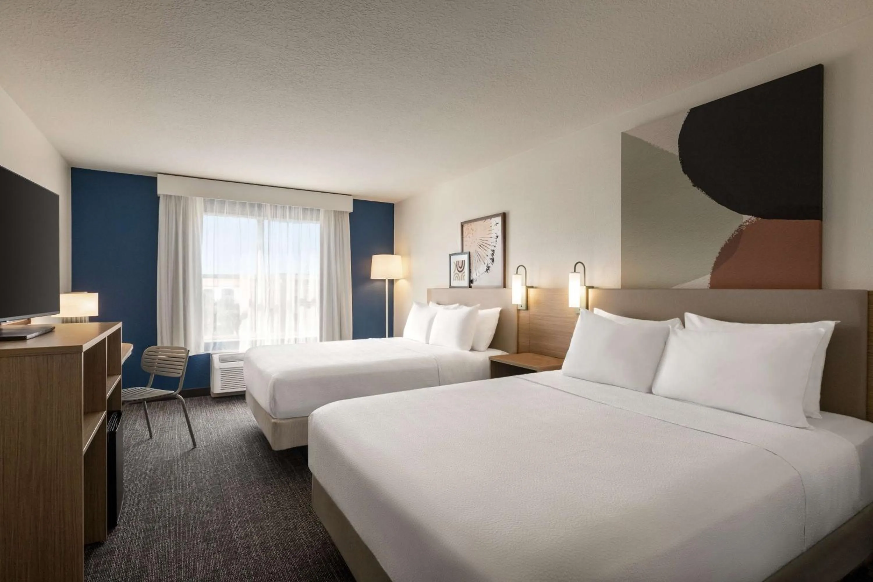 Bed in Spark by Hilton Orlando Universal Boulevard