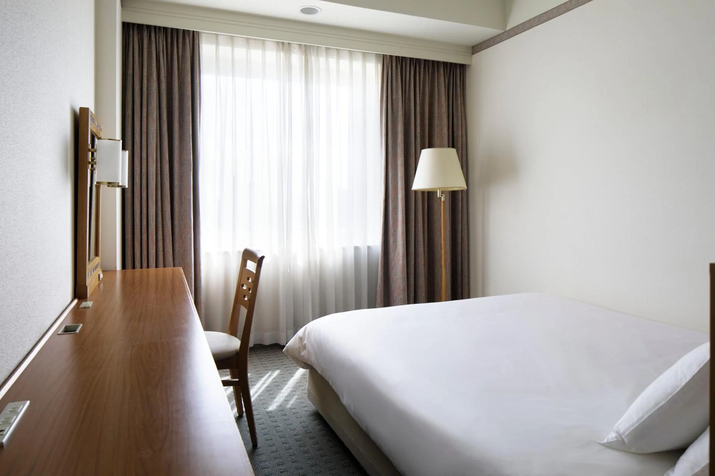 Bed in The Mark Grand Hotel