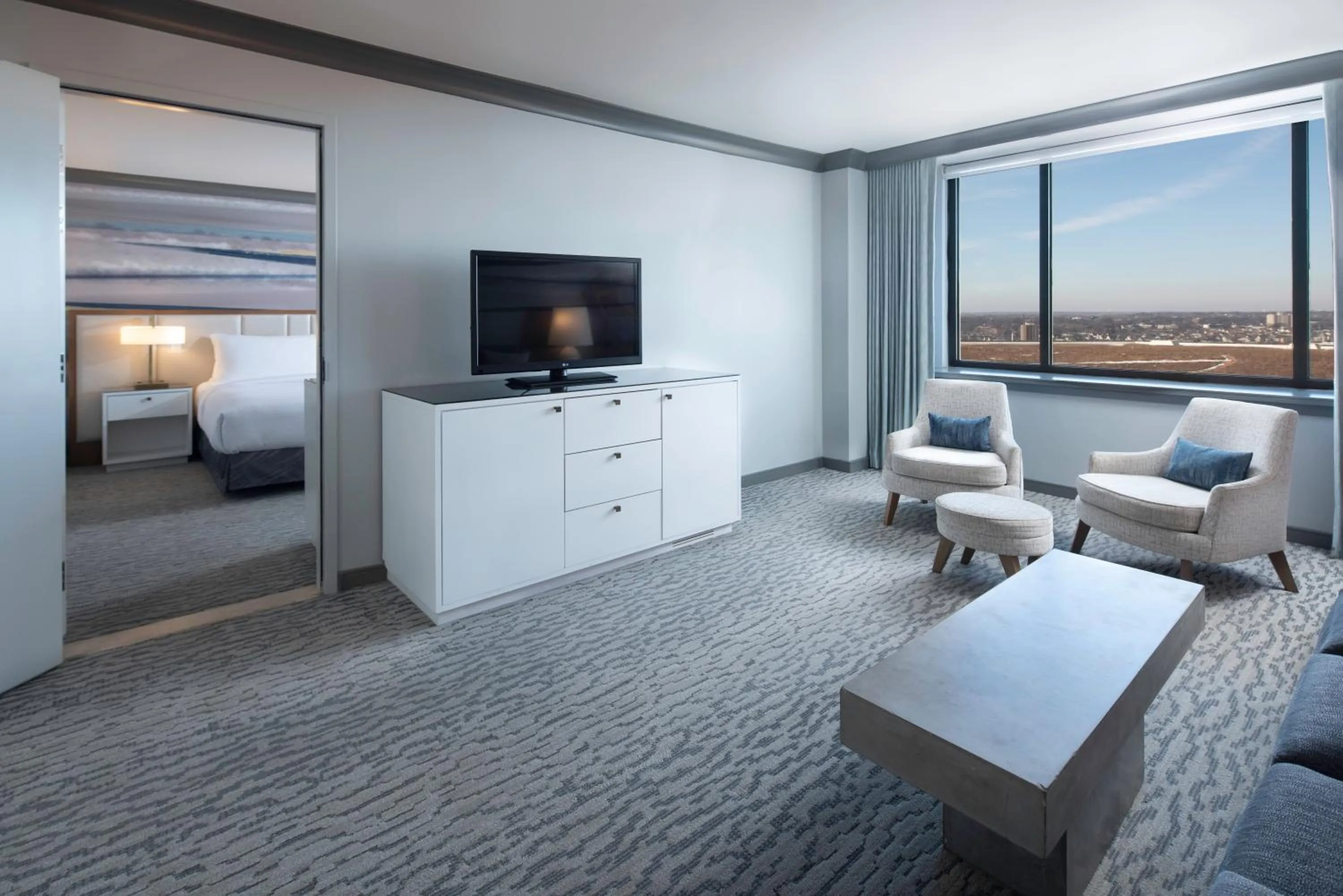 Living room, Bed in The Lofton Hotel Minneapolis, Tapestry Collection by Hilton