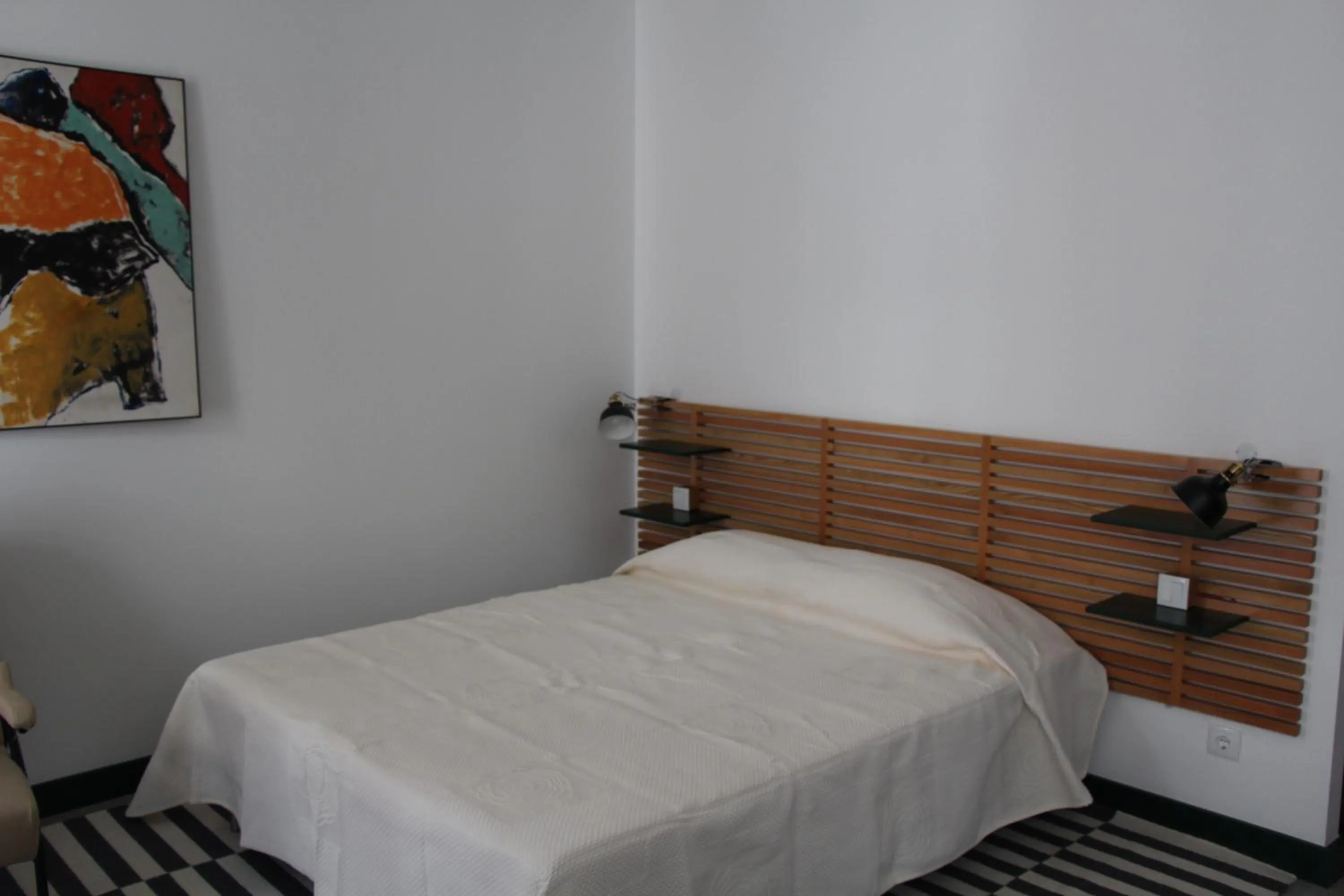 Bed in DoBairro suites at Bairro Alto