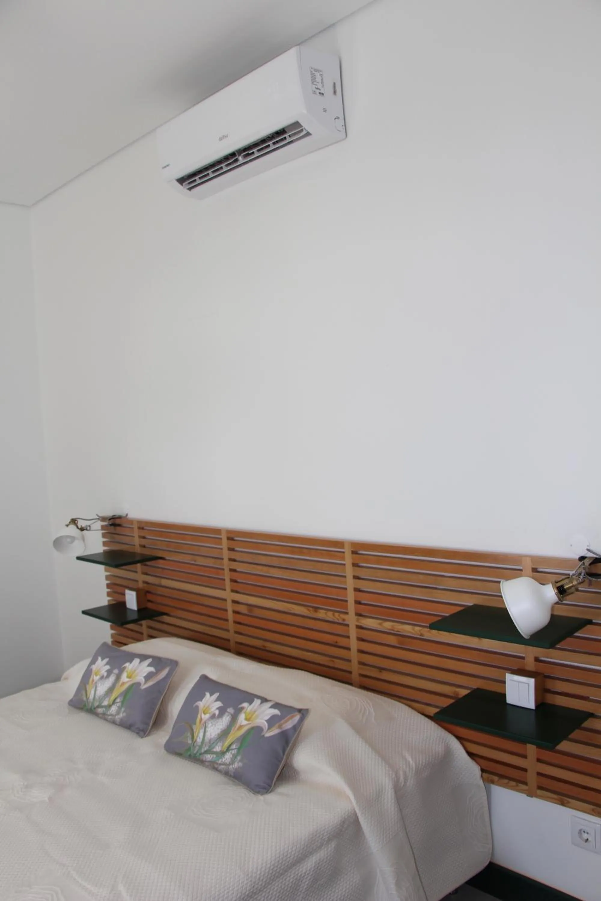 Bed in DoBairro suites at Bairro Alto
