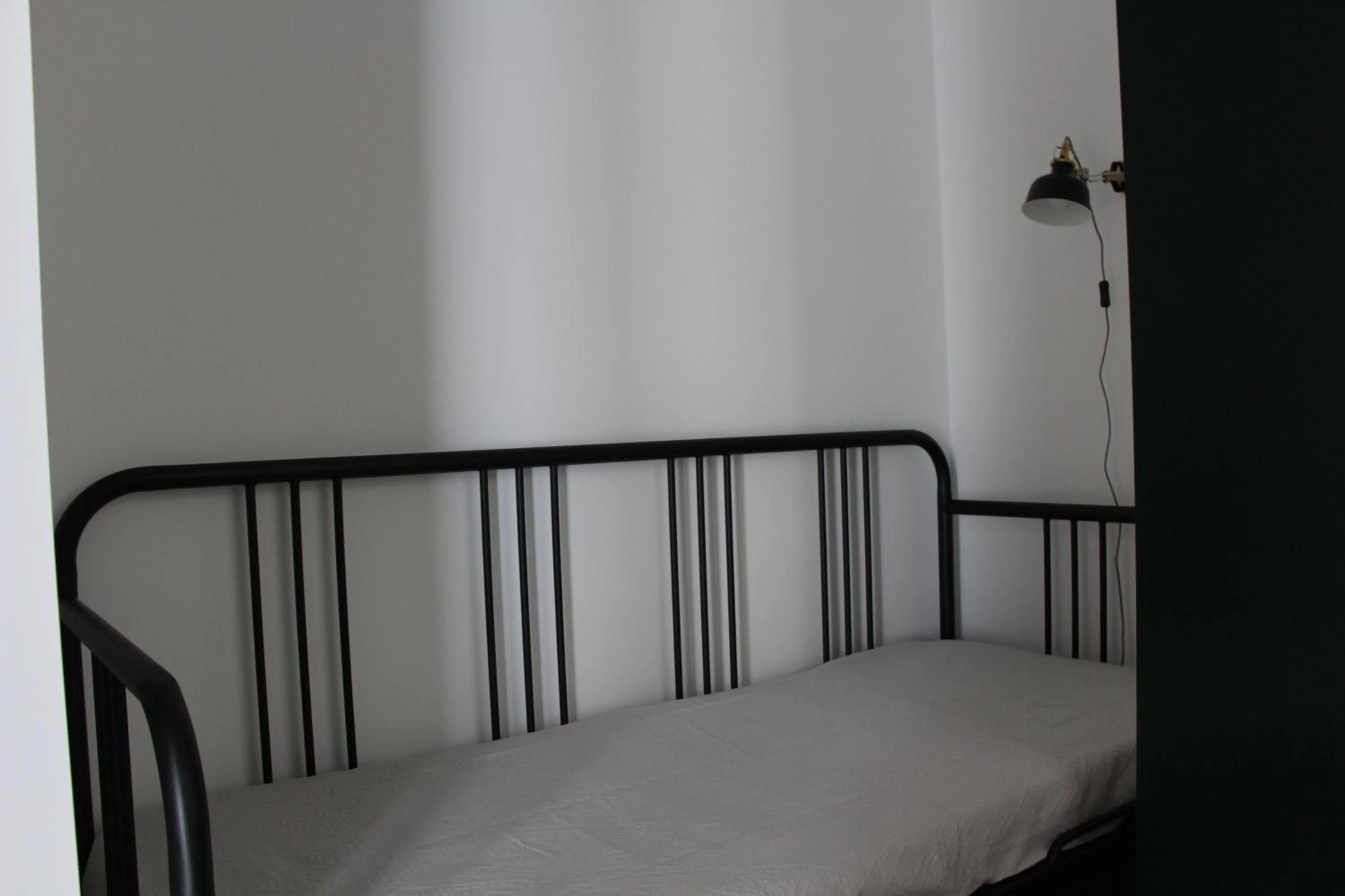 Bed in DoBairro suites at Bairro Alto