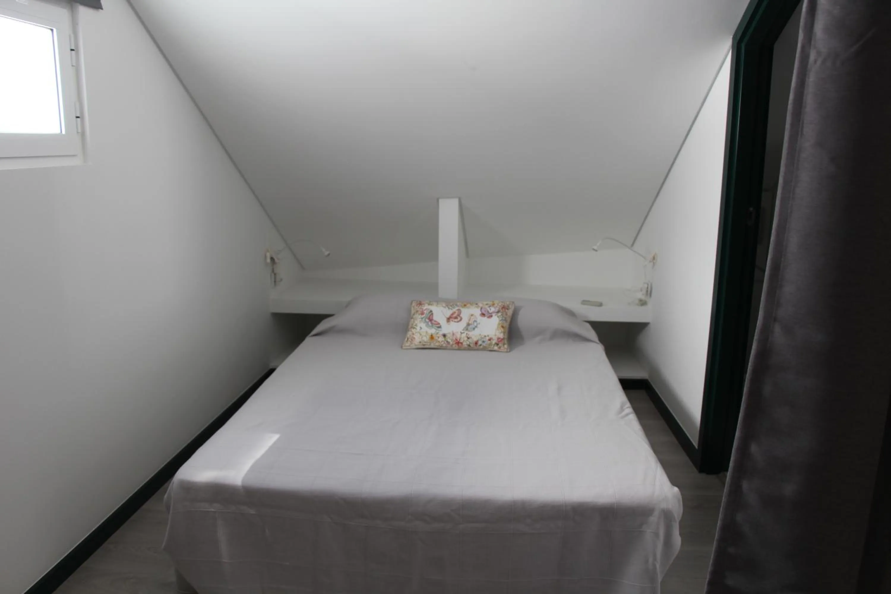 Bed in DoBairro suites at Bairro Alto
