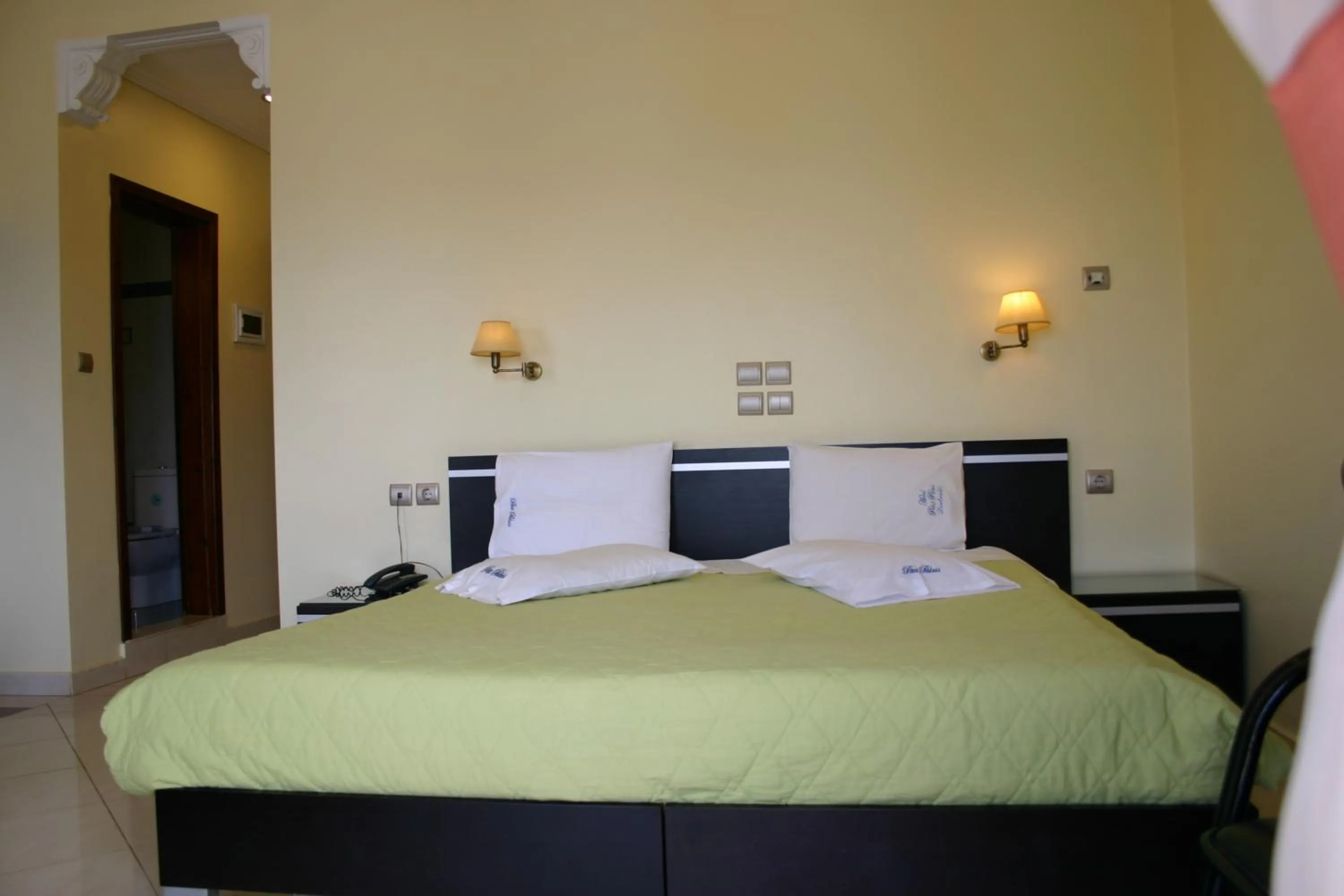 Bed in Petit Palais Hotel