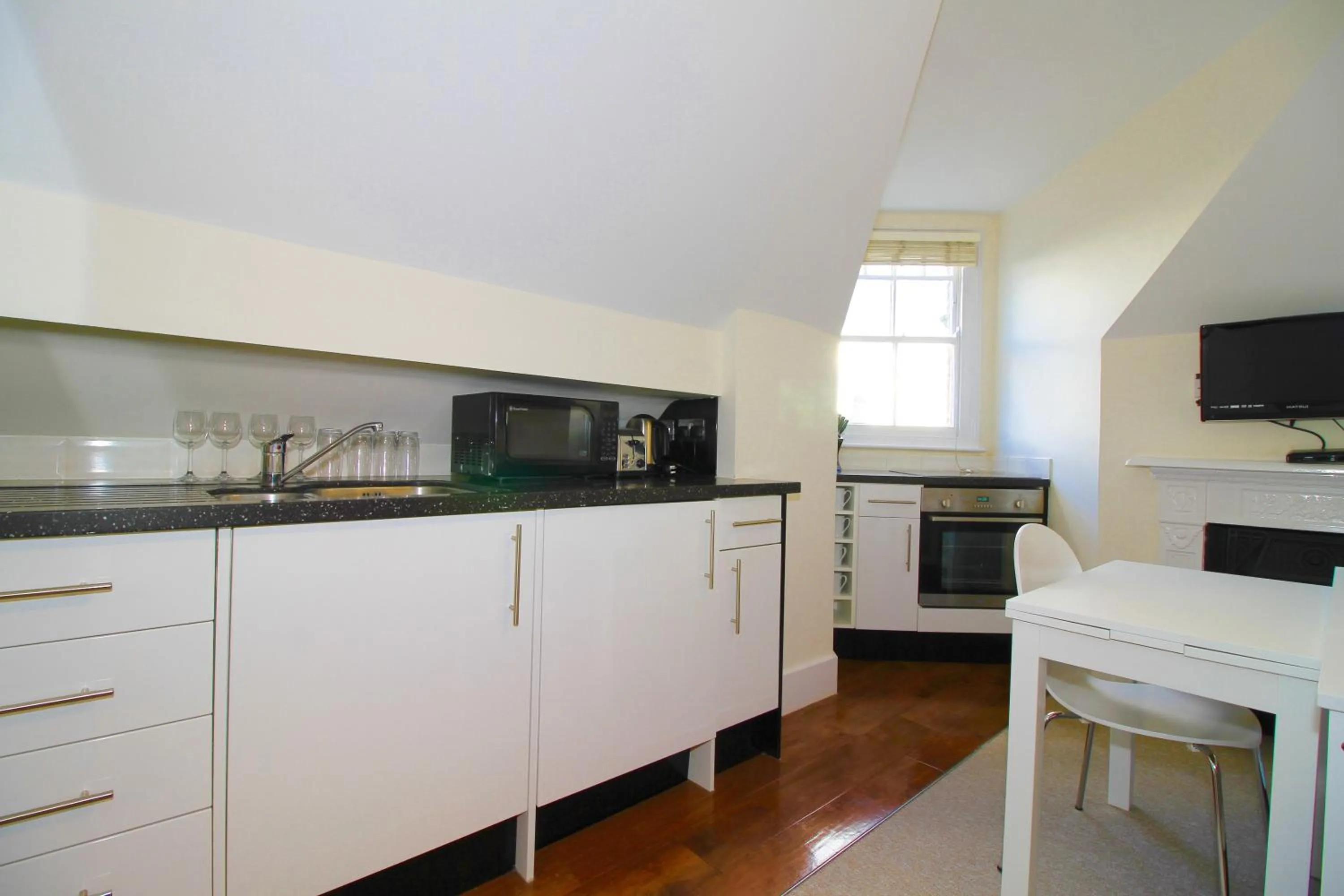 Kitchen or kitchenette in Noa Residence
