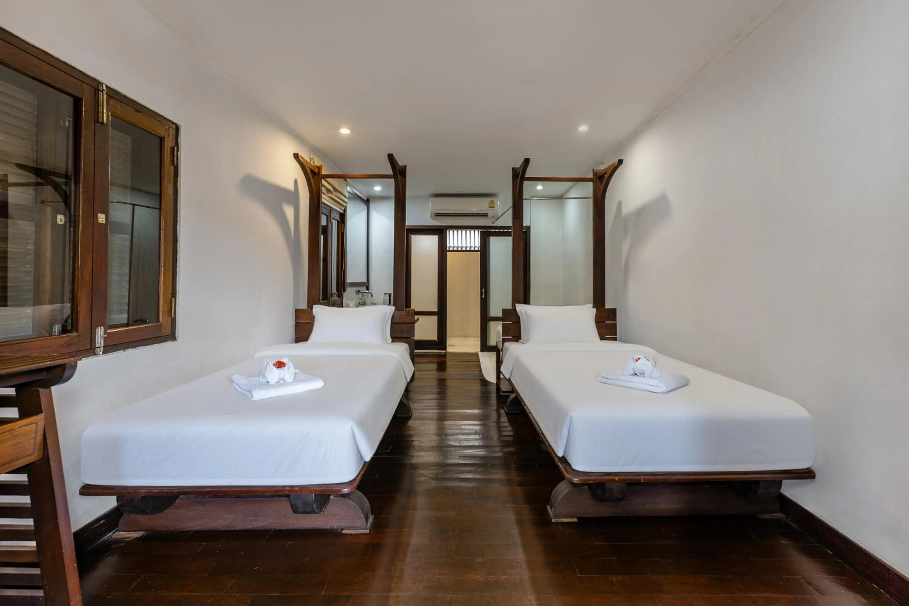 Bed in Ancient Luangprabang Hotel