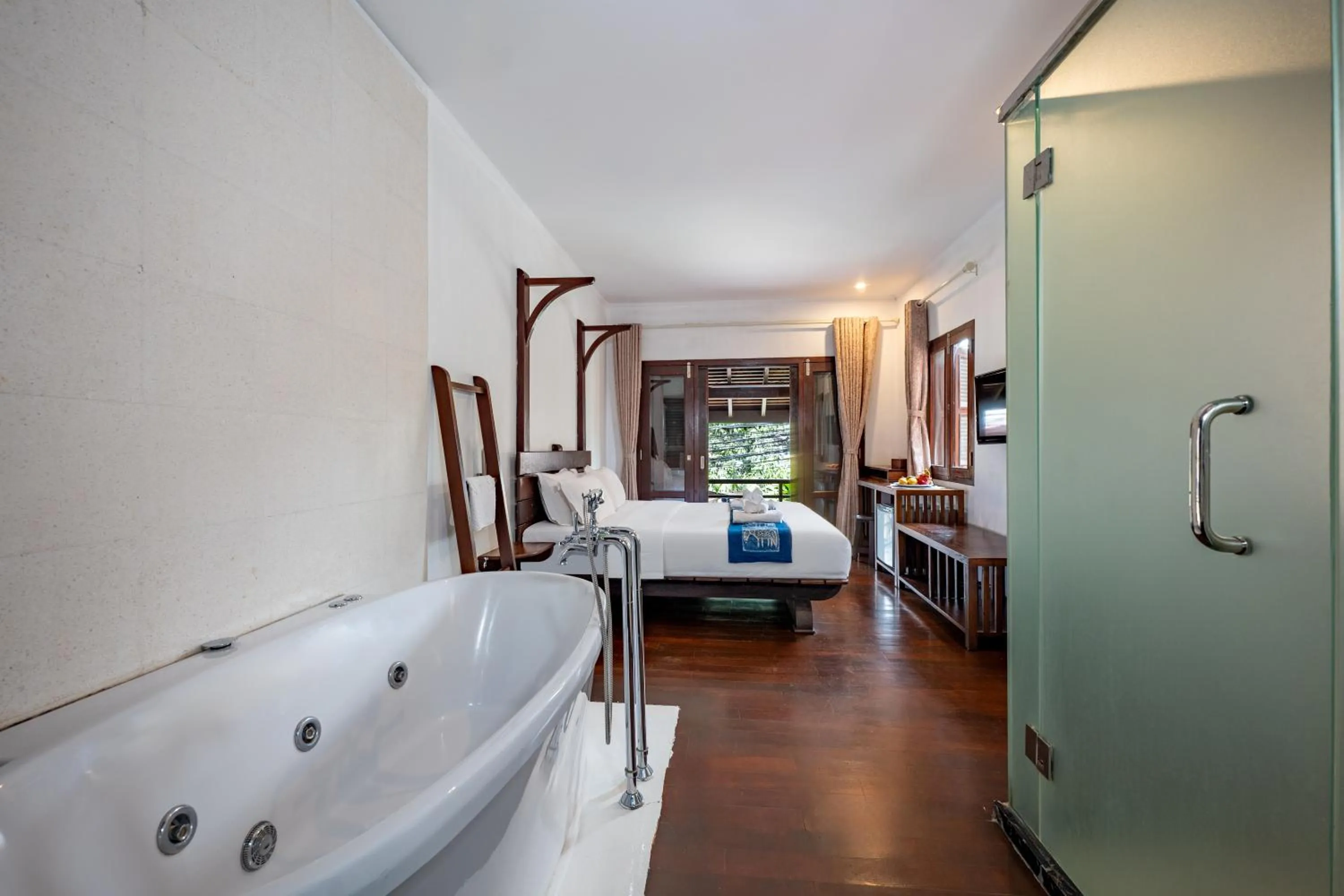 Bed in Ancient Luangprabang Hotel