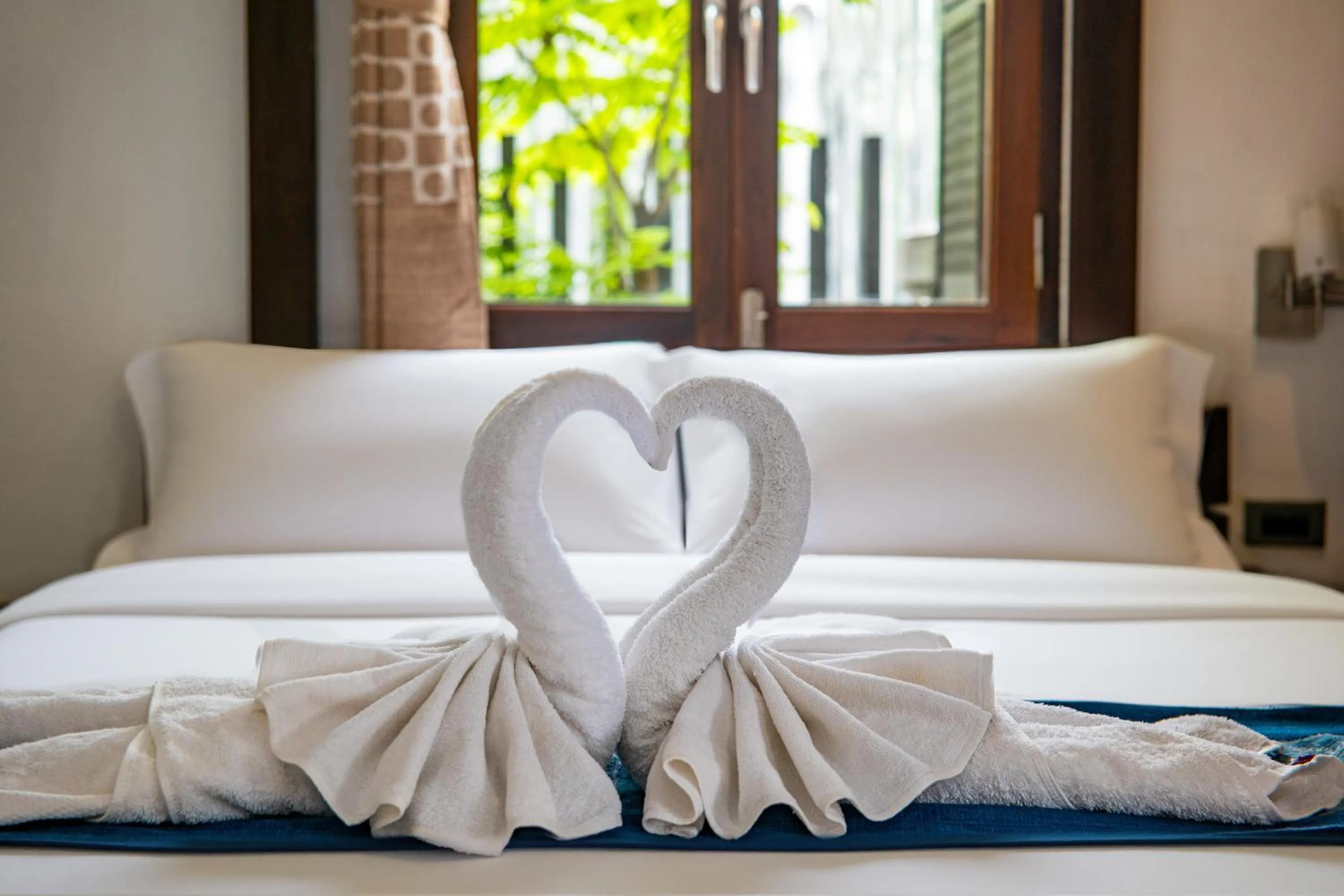 Bed in Ancient Luangprabang Hotel