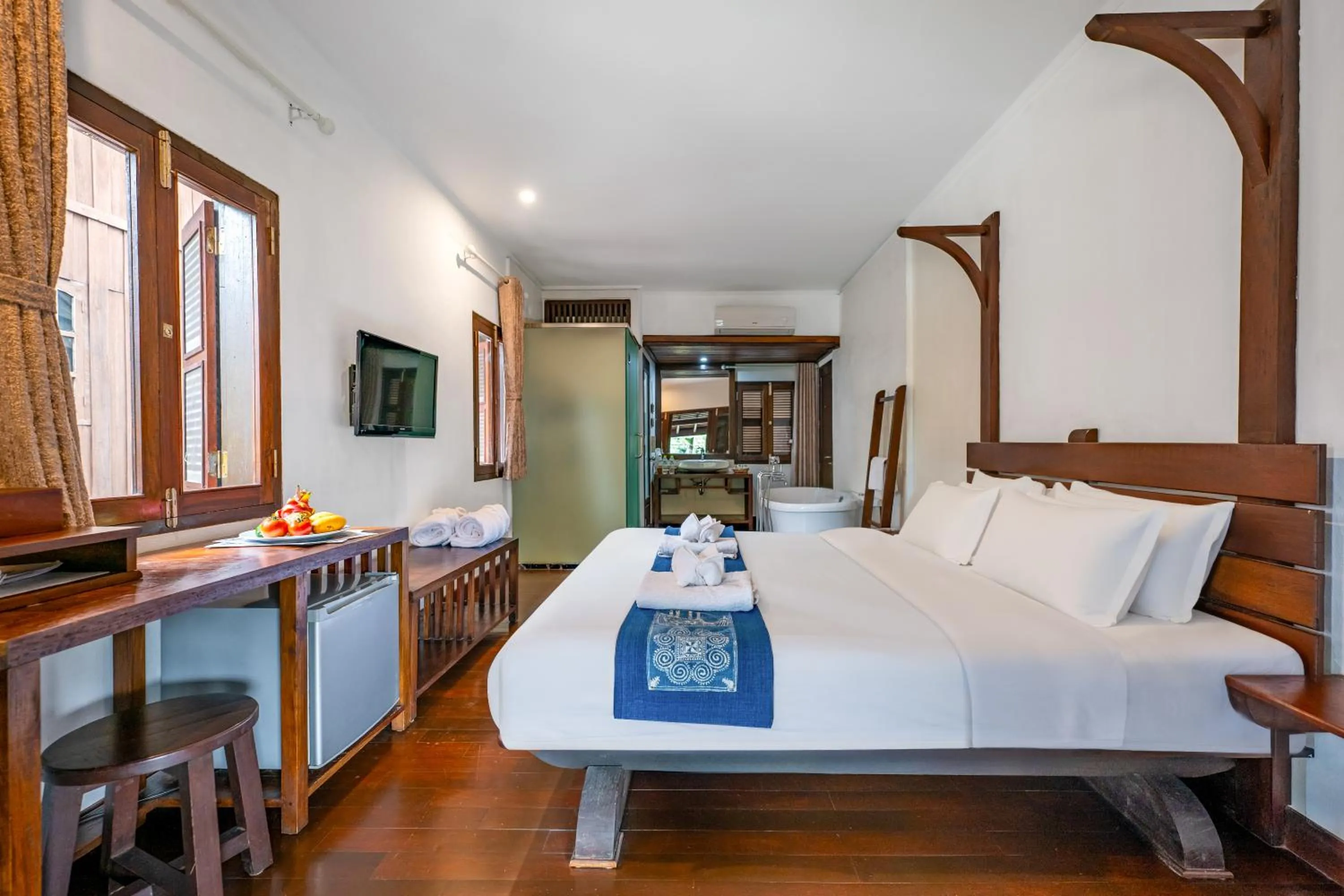 Bed in Ancient Luangprabang Hotel