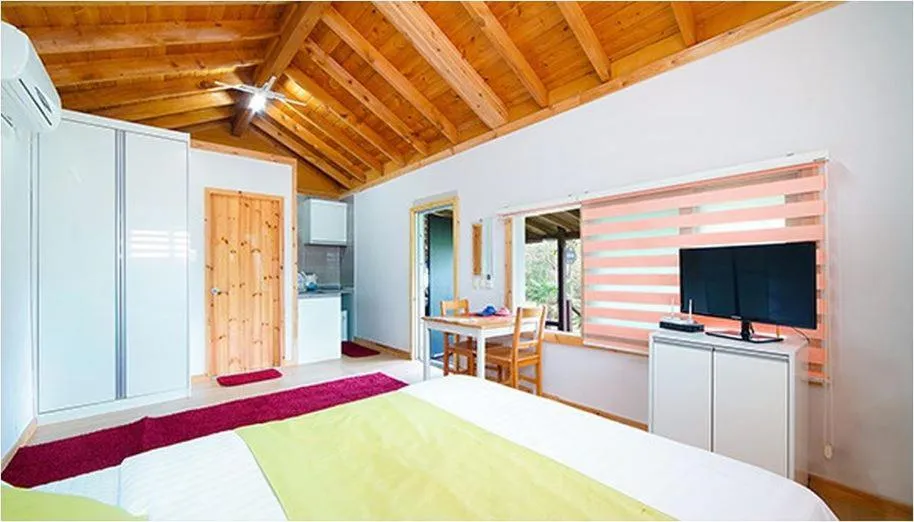 Bed in Gotjawal Geomunoreum Pension