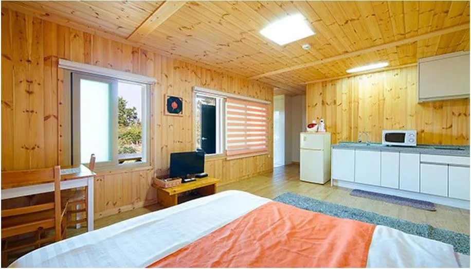 Bed in Gotjawal Geomunoreum Pension