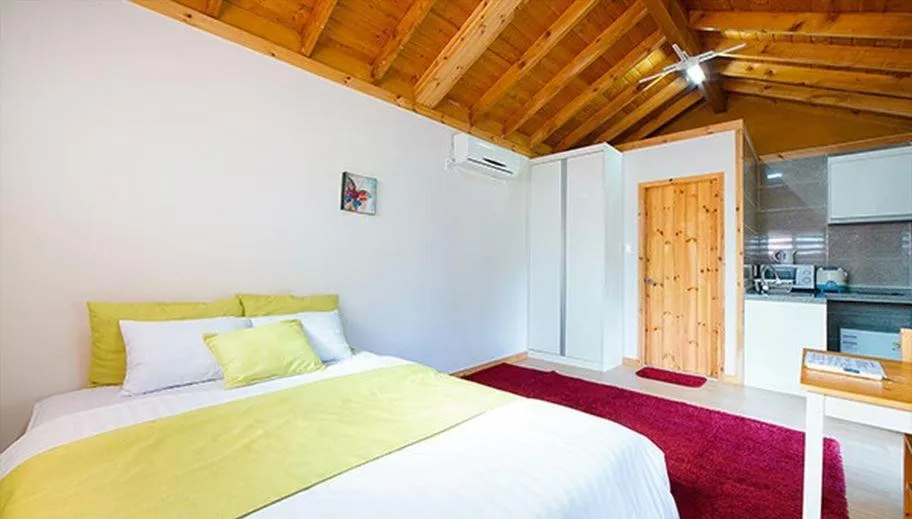 Bed in Gotjawal Geomunoreum Pension