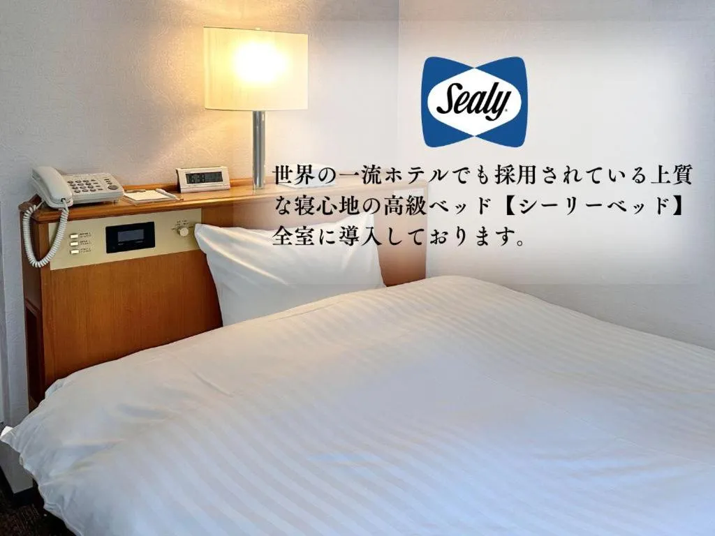 Bed in Hotel New Saitama