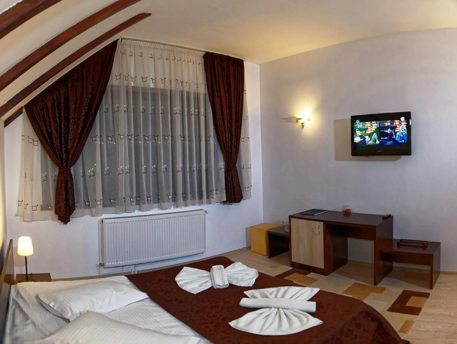 Photo of the whole room, Bed in Hotel boutique Garden Resort by Brancoveanu