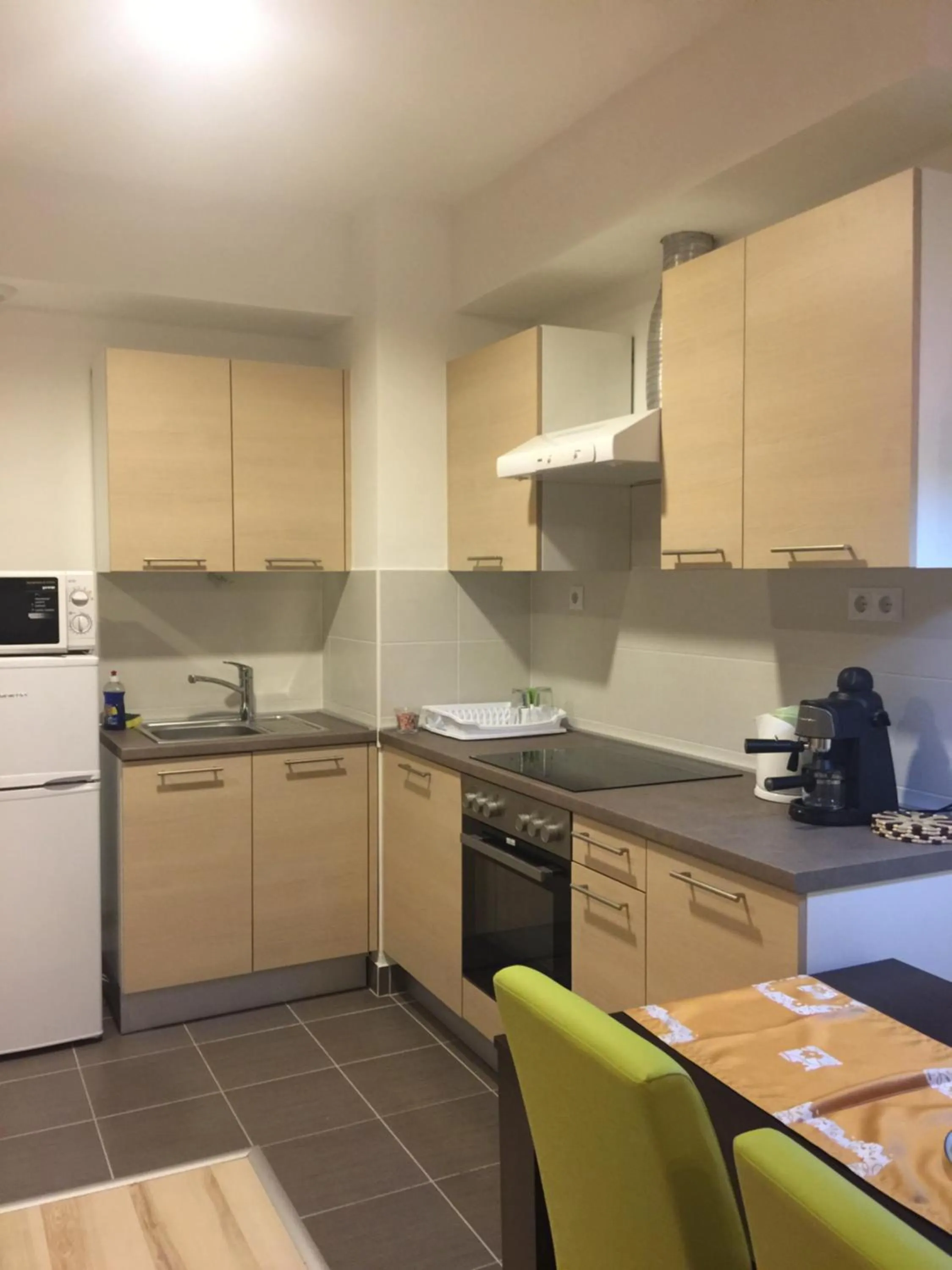 Kitchen or kitchenette in Corvin Rose Apartment Hotel