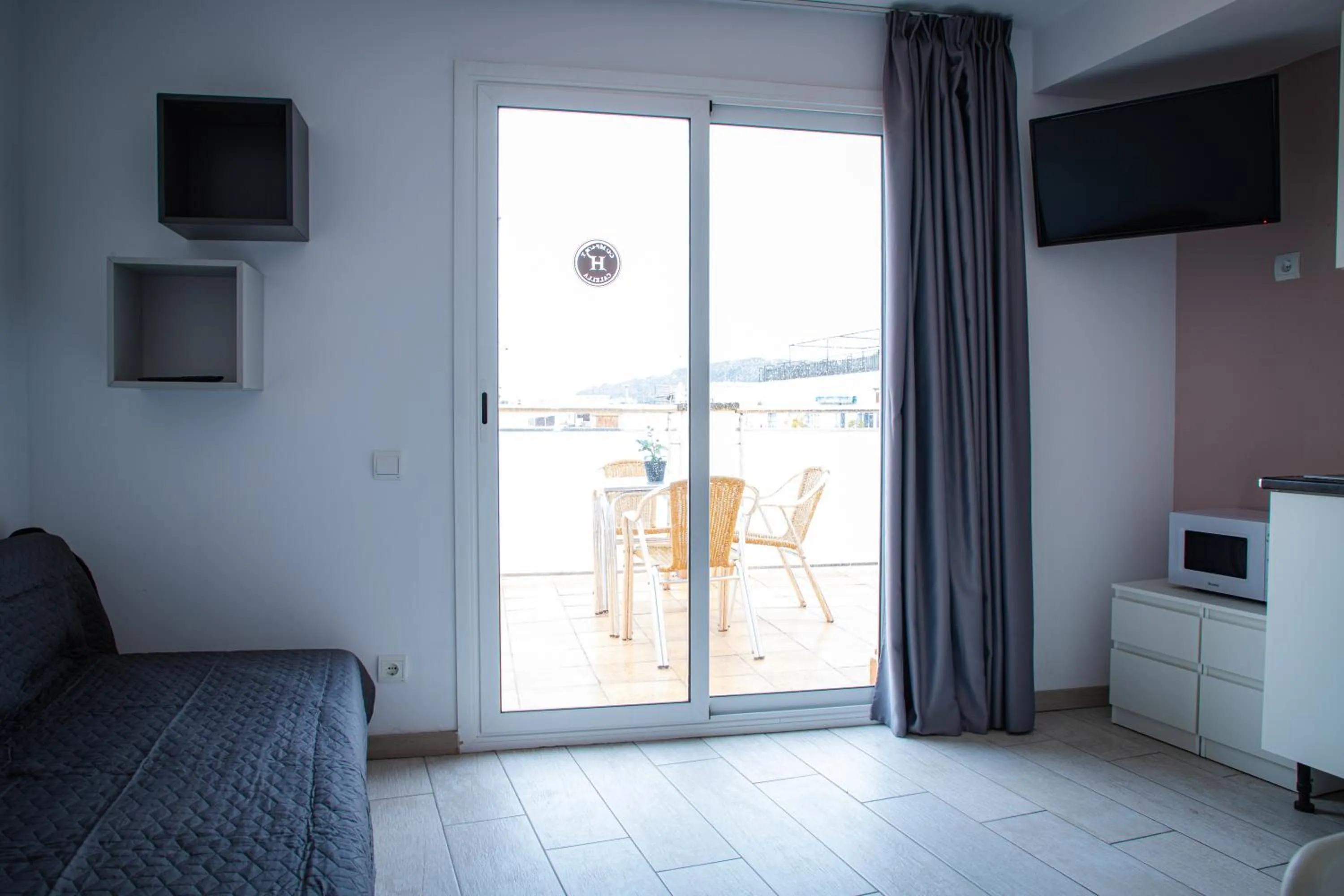 Communal lounge/ TV room in Apartamentos Comfort Calella