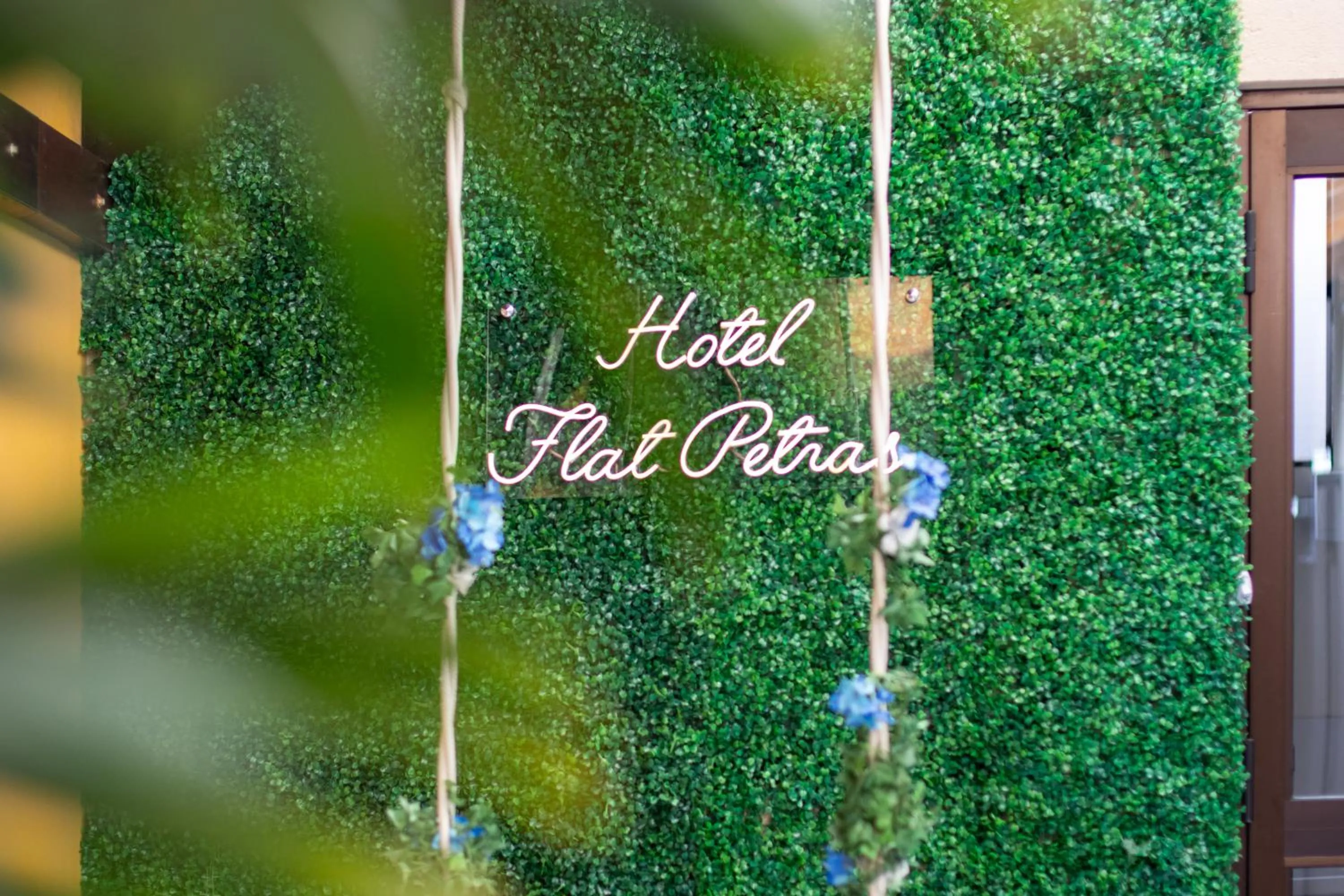 Property logo or sign in Hotel Flat Petras Residence