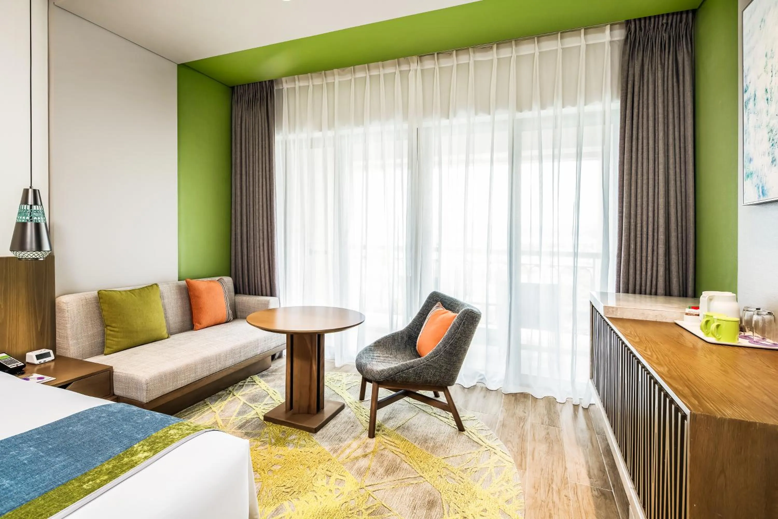 Seating area, Bed in Holiday Inn Resort Sanya Bay by IHG