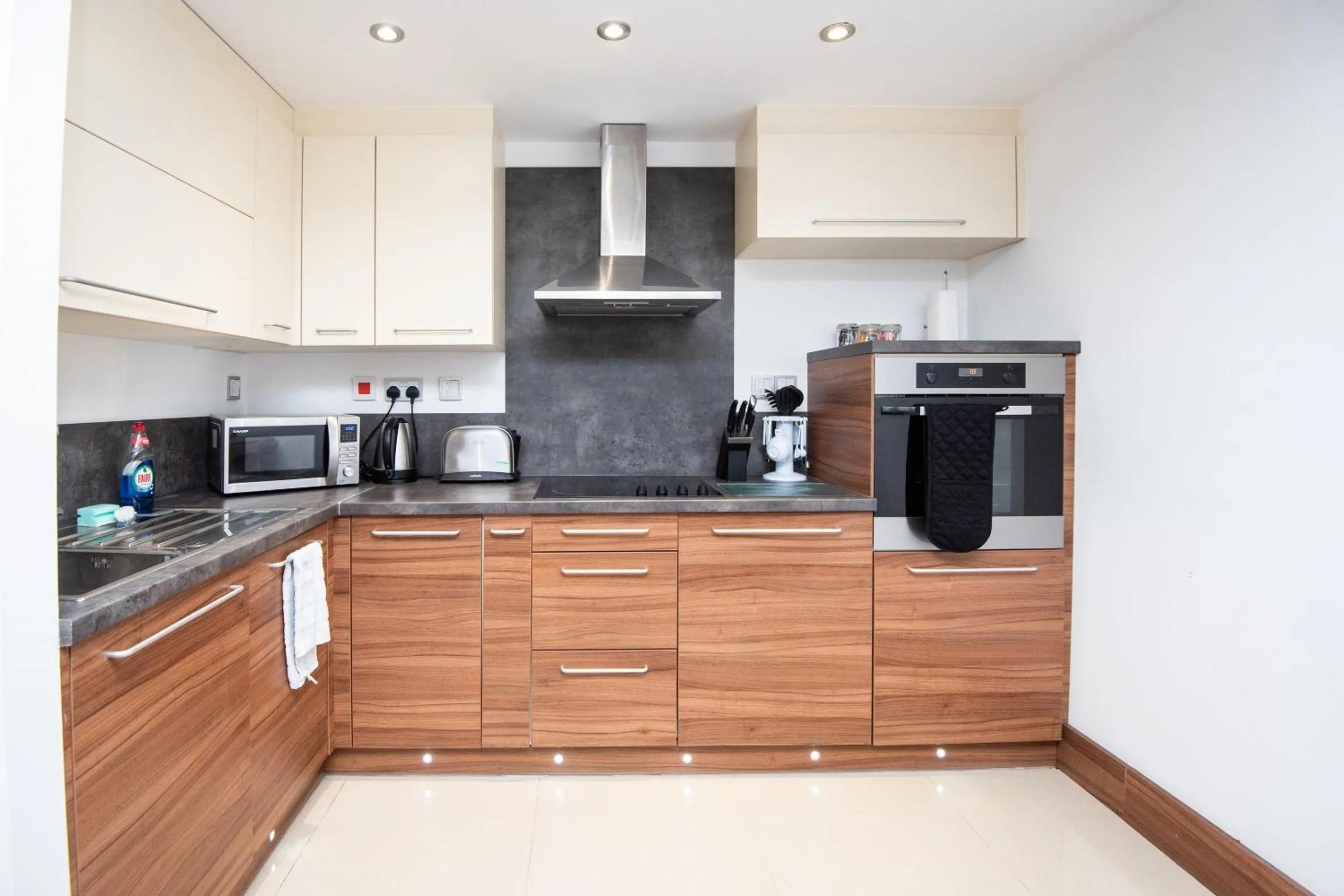 Kitchen or kitchenette in Livin' Serviced Apartments