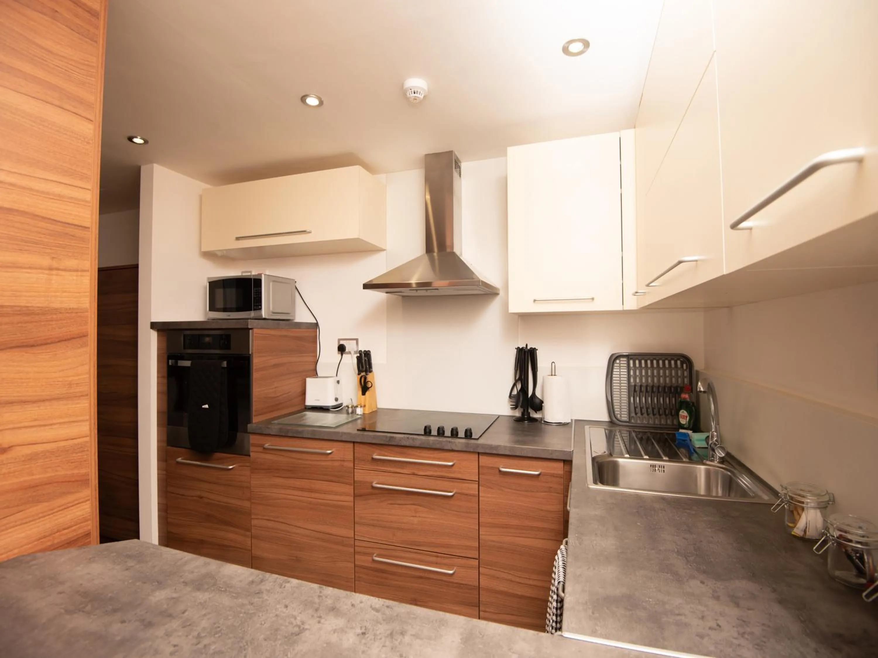 Kitchen or kitchenette in Livin' Serviced Apartments