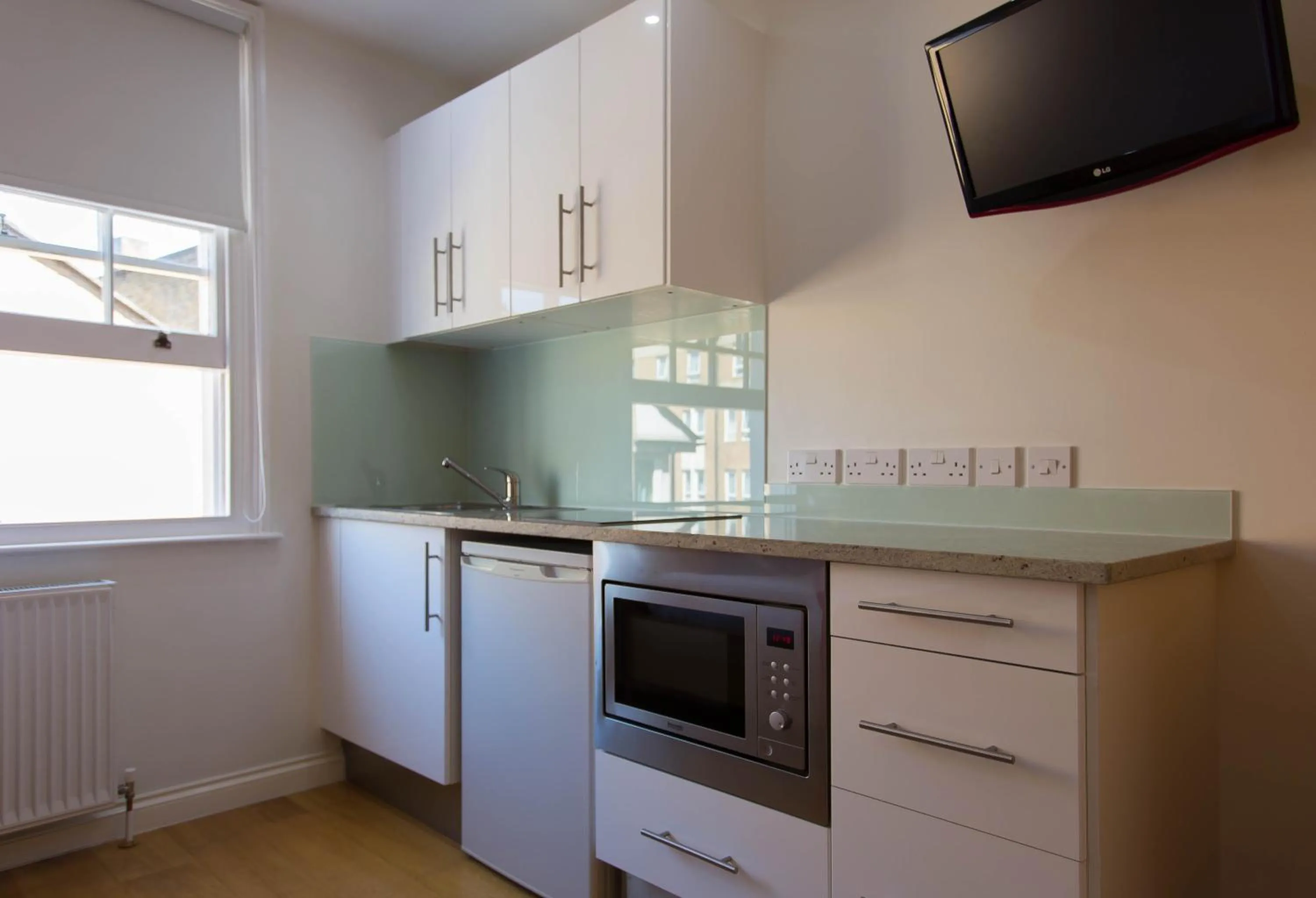 Kitchen or kitchenette in Paddington Green Serviced Apartments by Concept Apartments