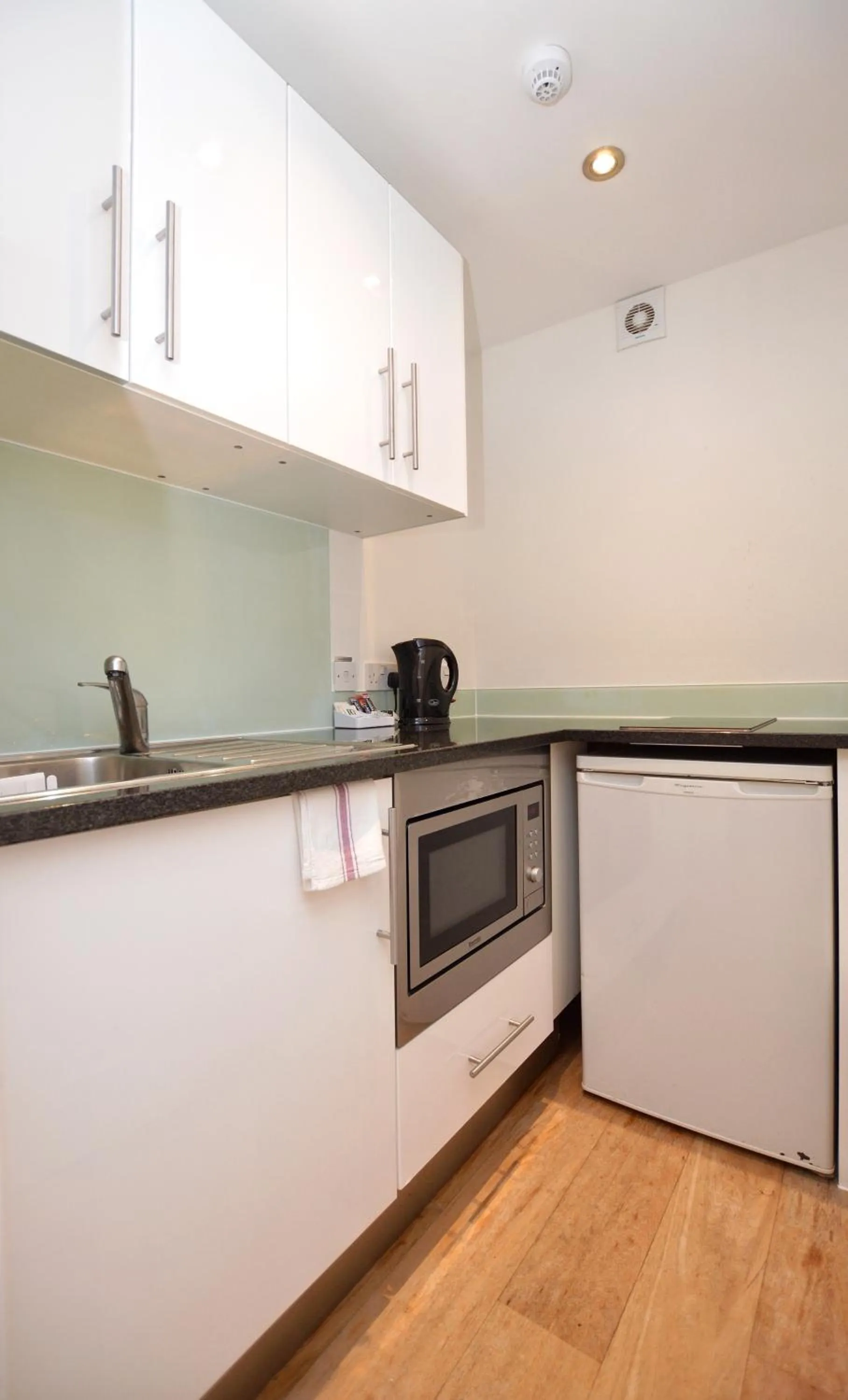 Kitchen or kitchenette in Paddington Green Serviced Apartments by Concept Apartments