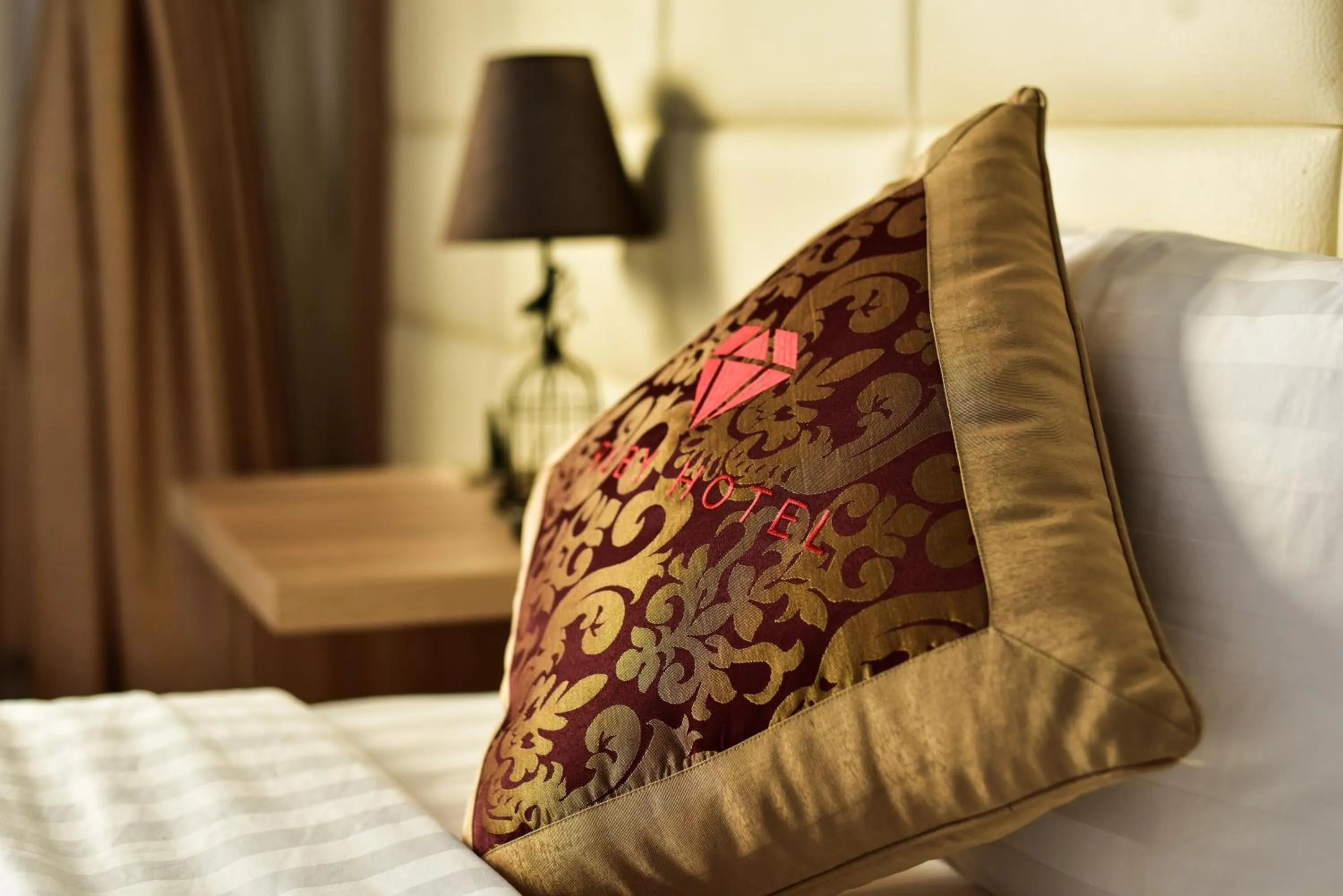 Property logo or sign, Bed in Ruby Hotel