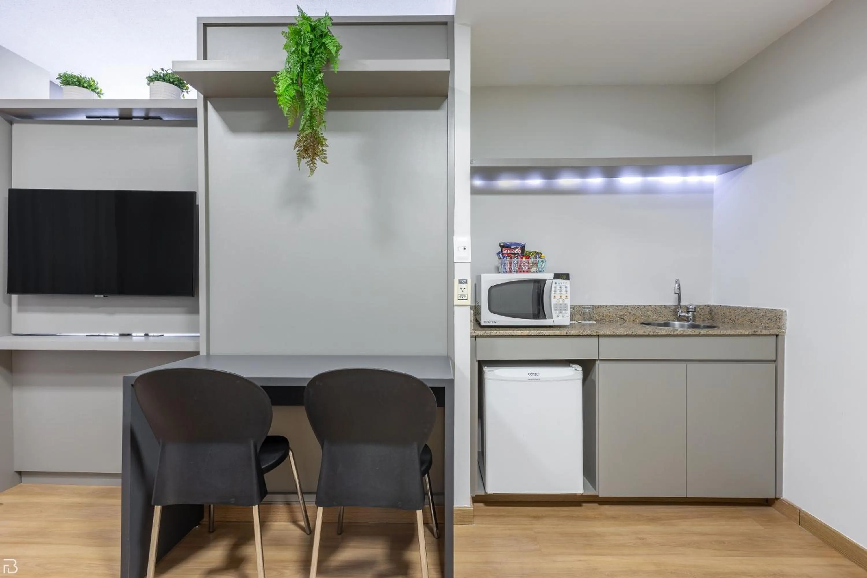 Communal lounge/ TV room in Nobile Suítes Uberlândia