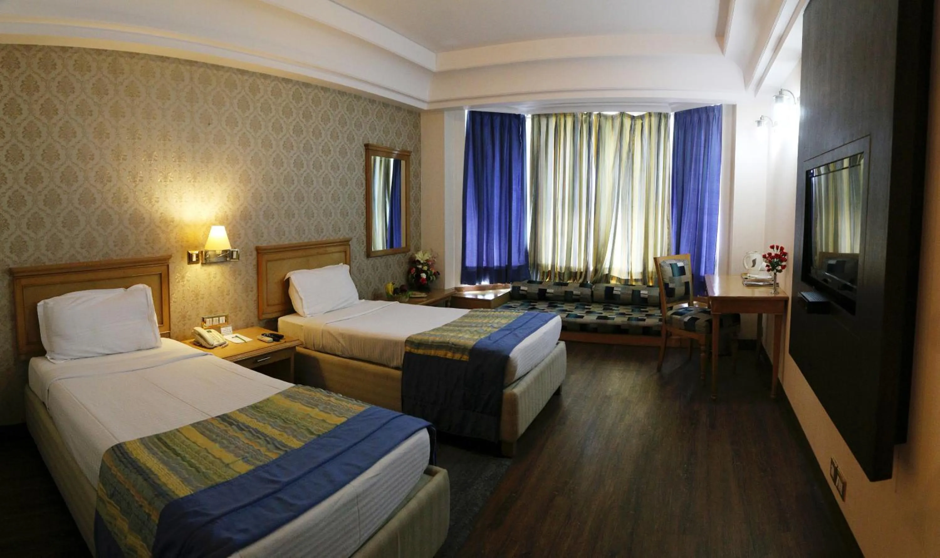 Bedroom in Dee Marks Airport Hotel & Resorts