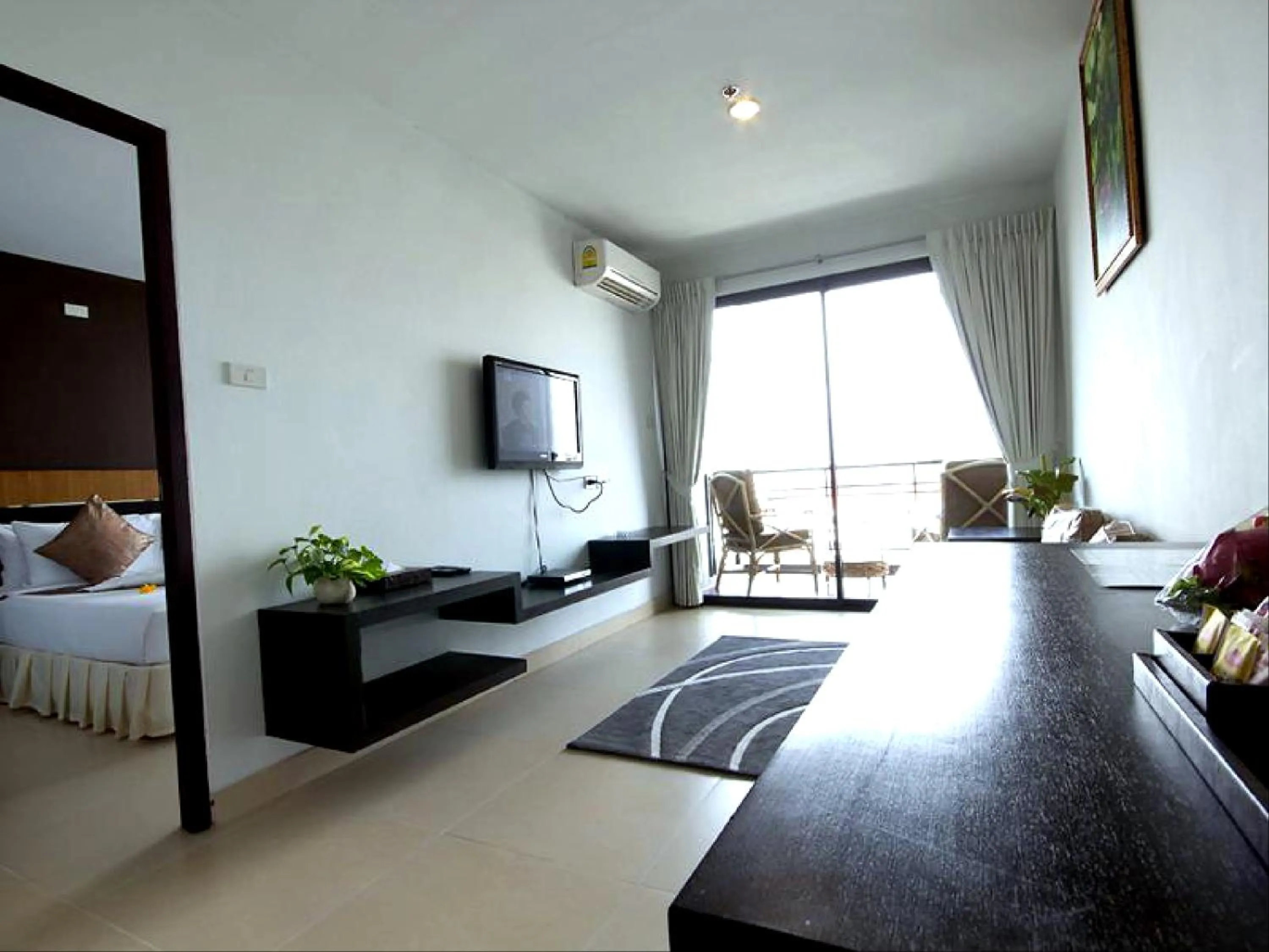 Living room, Bed in Vogue Pattaya Hotel