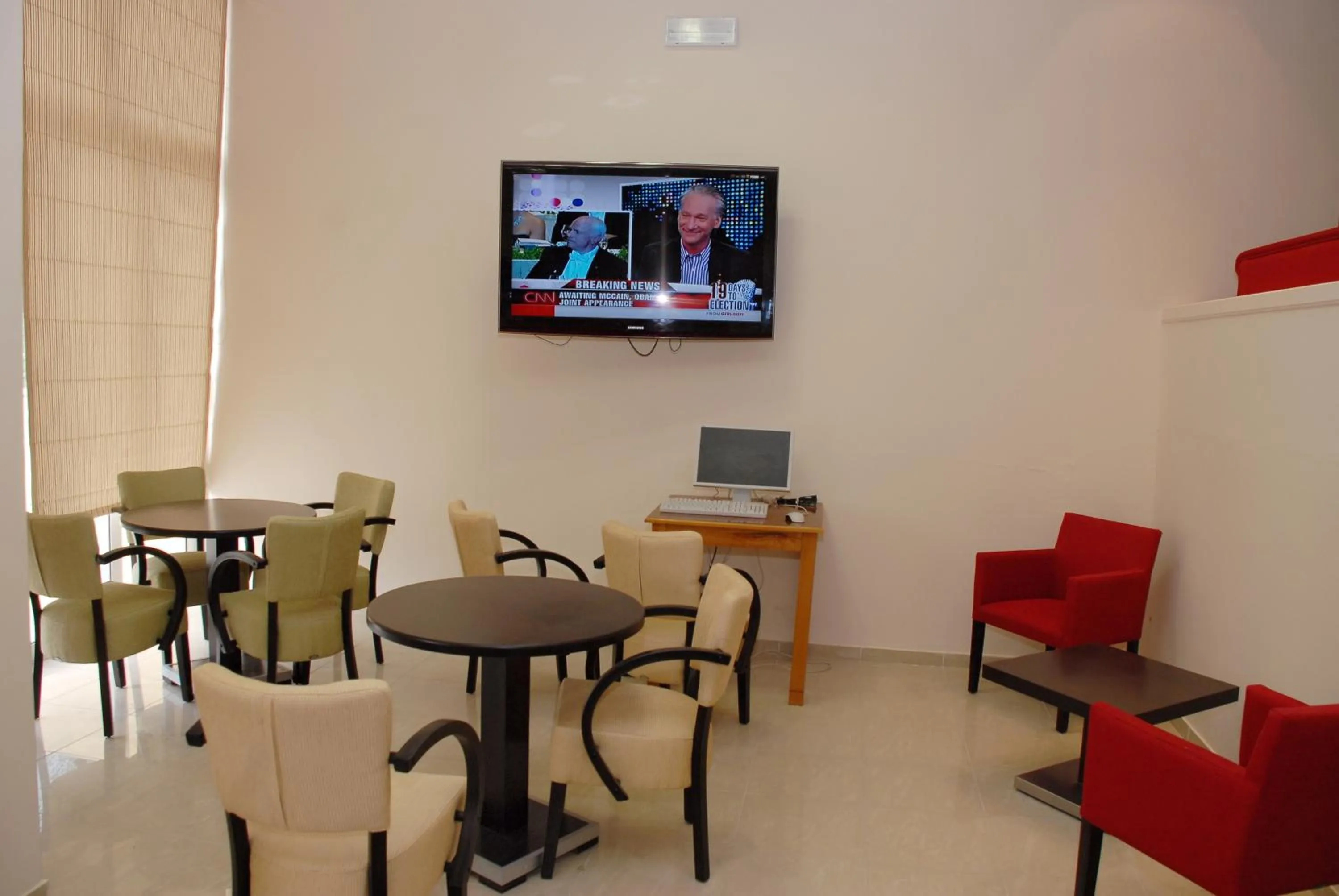 Communal lounge/ TV room in Glyfada Beach Hotel