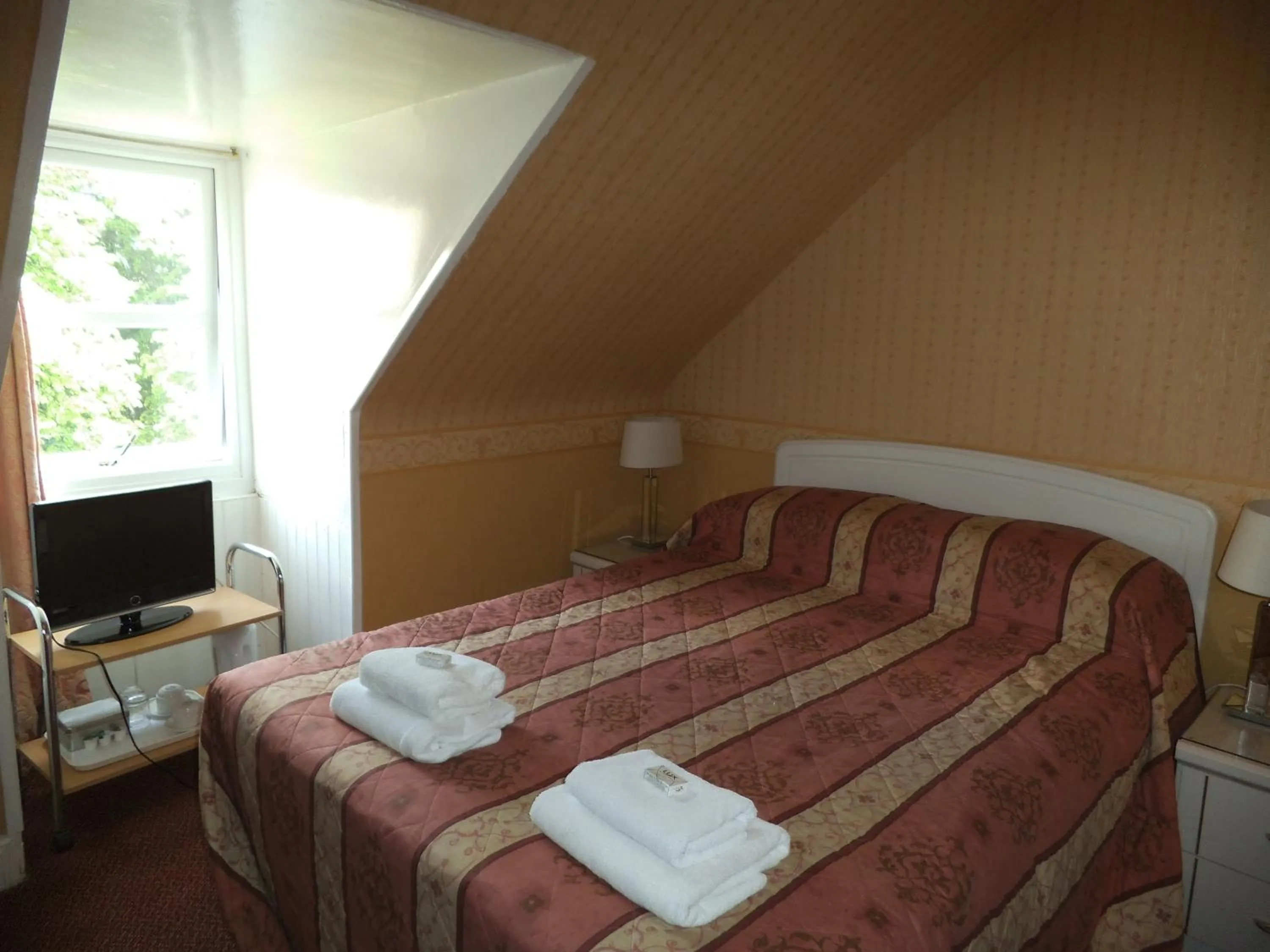 Bed in Menzies Guest House