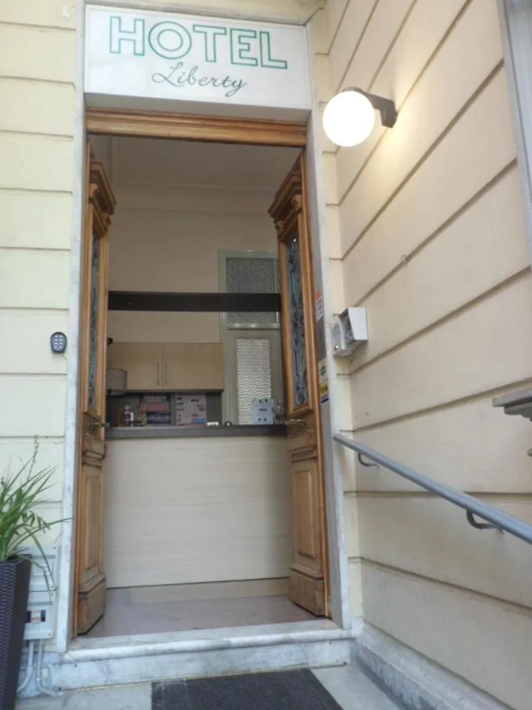 Property logo or sign in Hotel Liberty