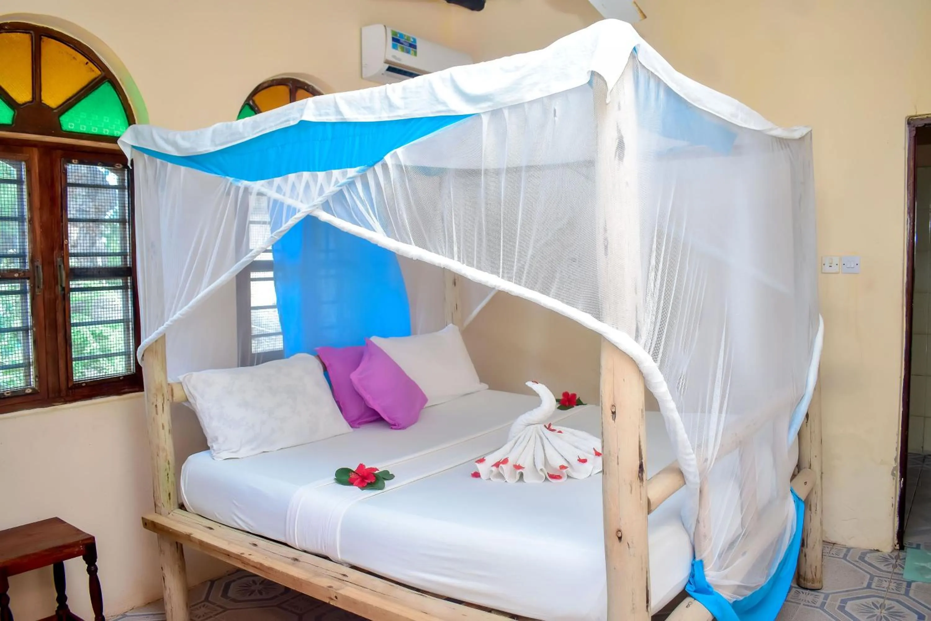 Bed in Blue Earth Beach Bungalow
