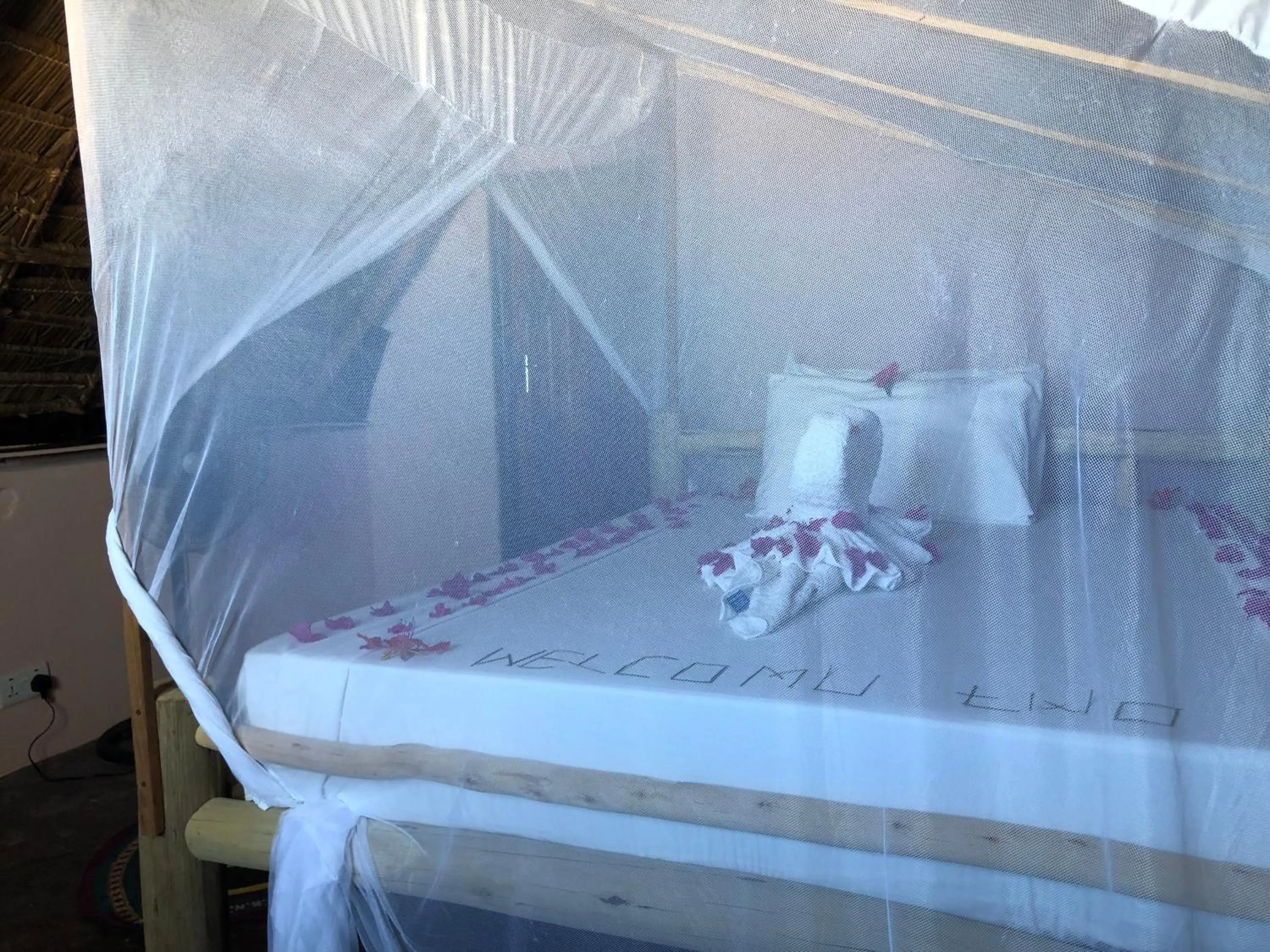 Bed in Blue Earth Beach Bungalow