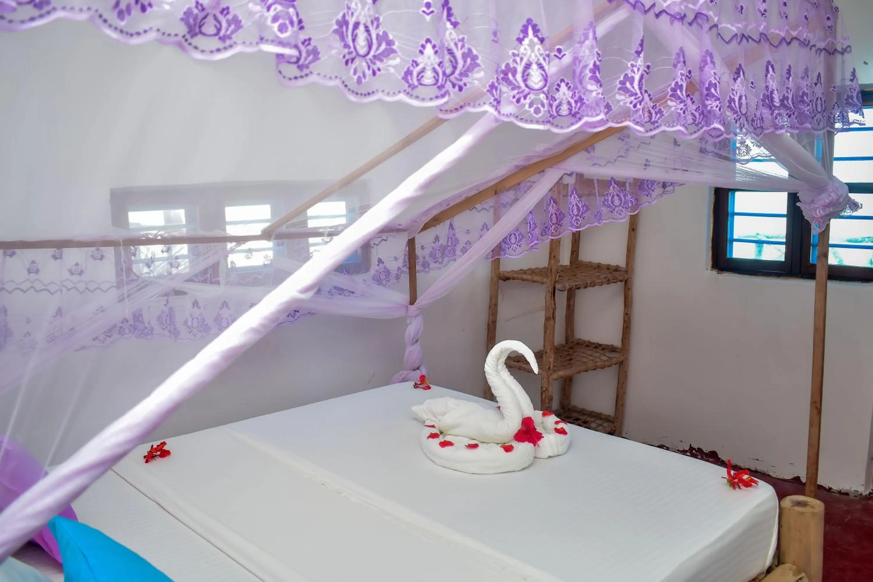 Bed in Blue Earth Beach Bungalow