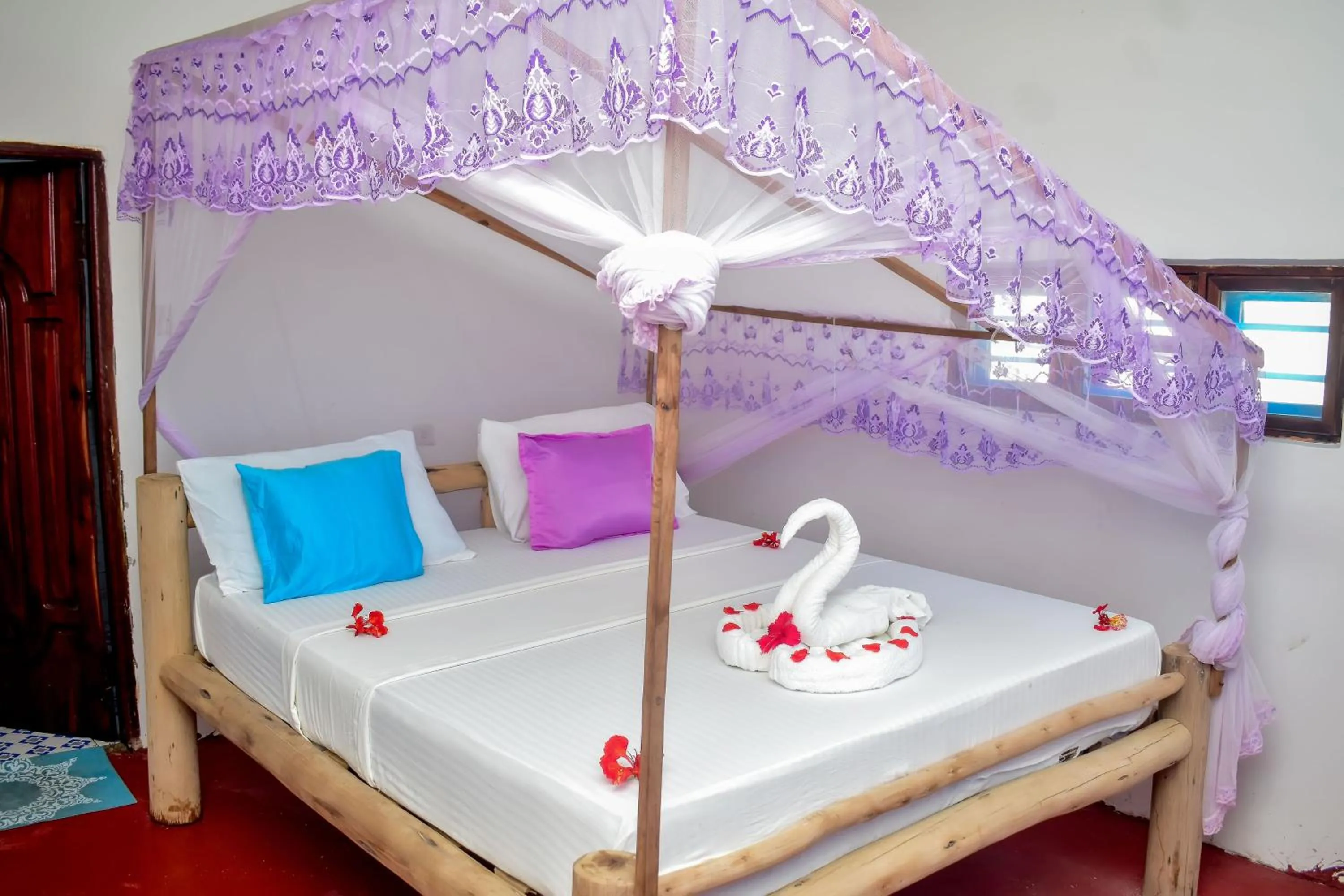 Bed in Blue Earth Beach Bungalow