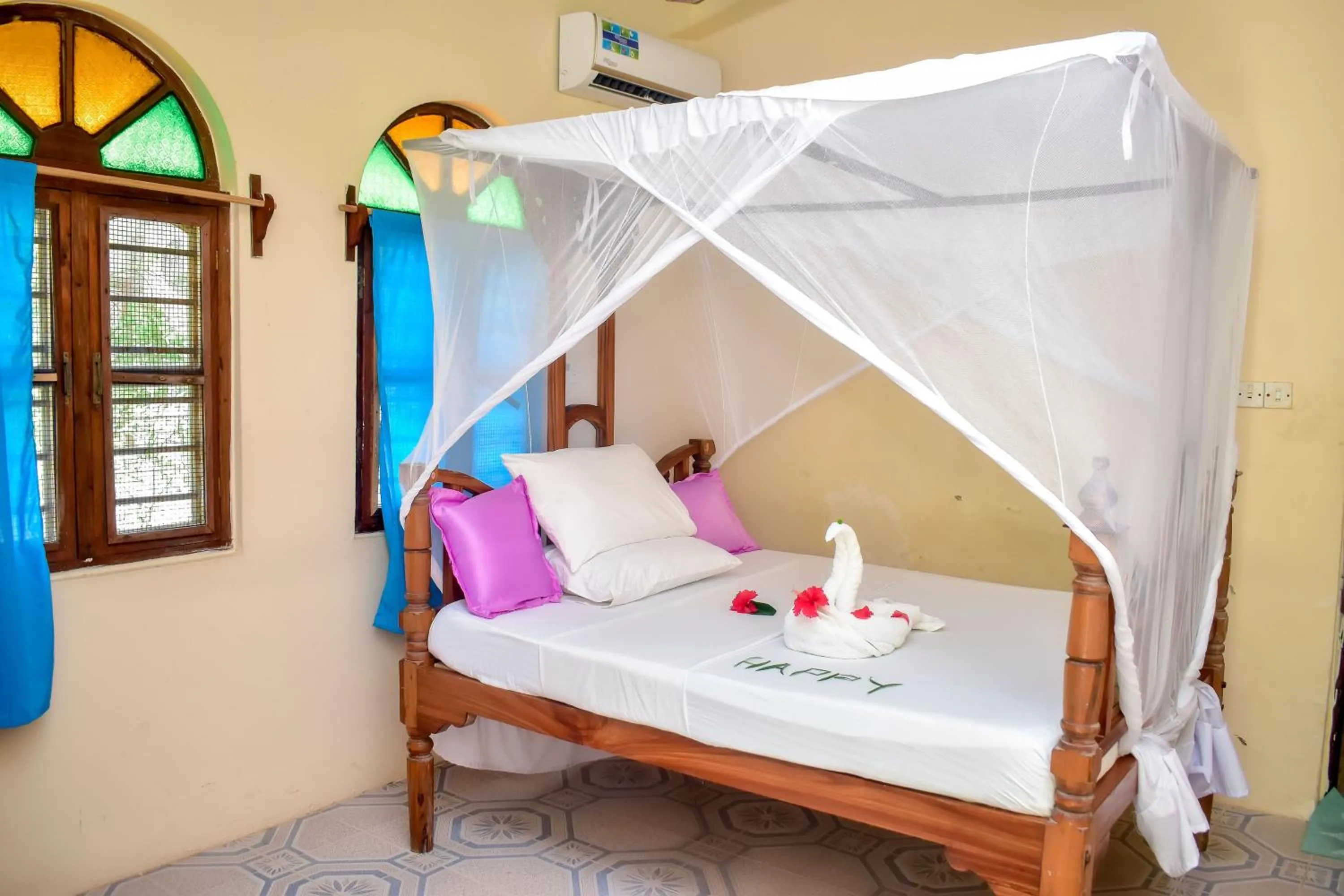 Bed in Blue Earth Beach Bungalow