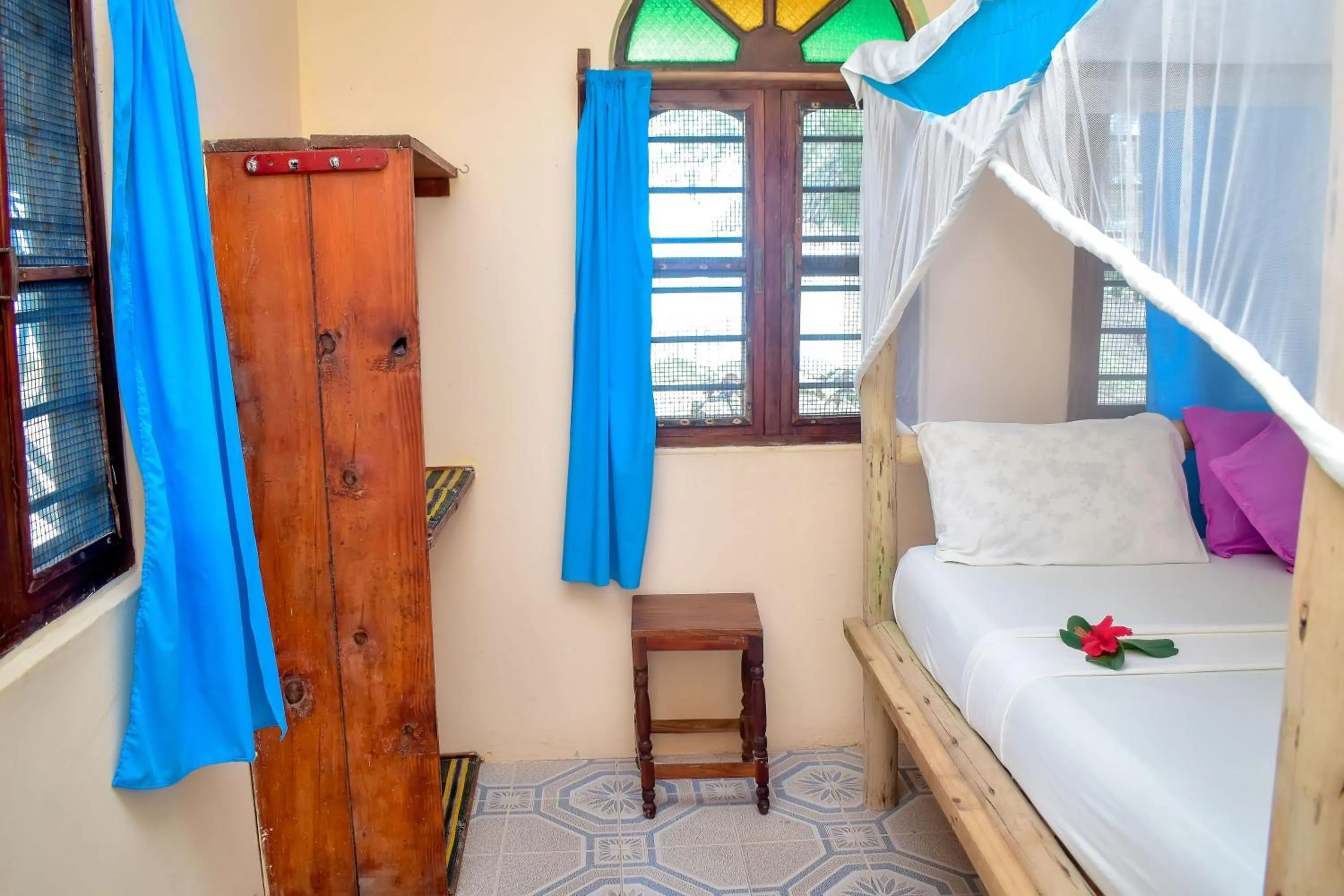 Bed in Blue Earth Beach Bungalow